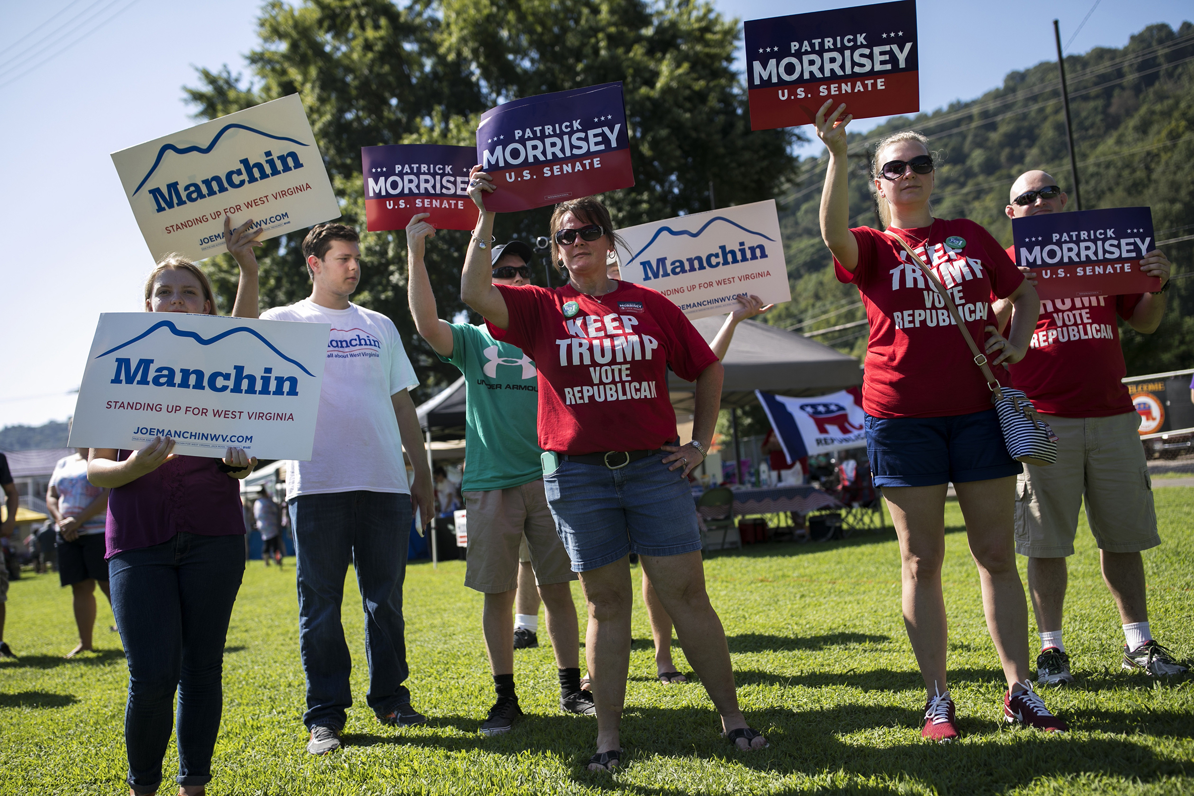 Demonstrators campaign on Sept. 3 in Marmet, W.Va., in a Senate race that has centered on health care (Maddie McGarvey—The New York Times/Redux)