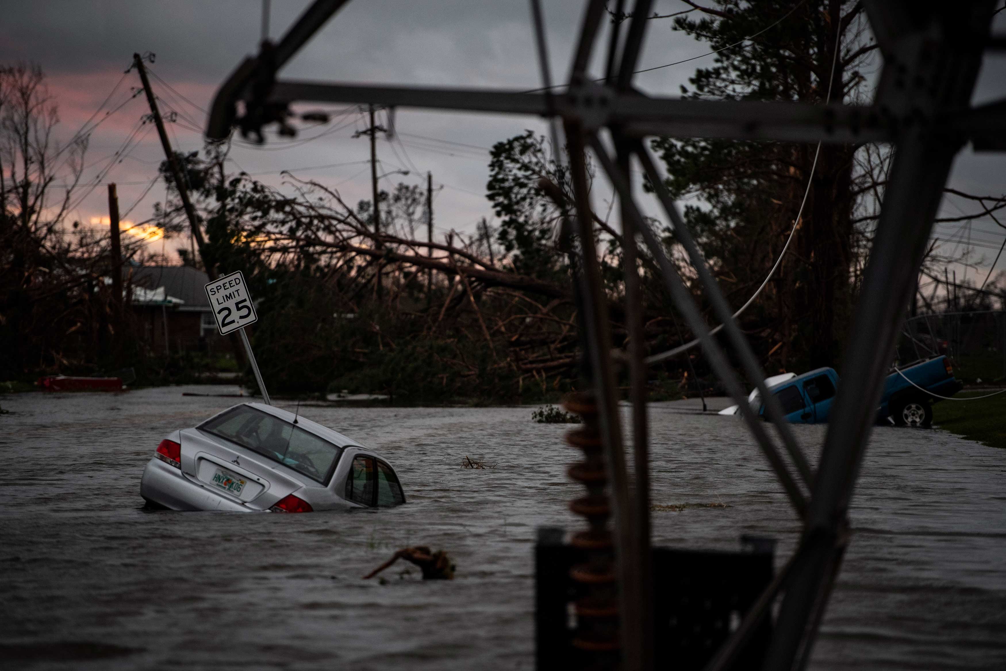 A car is seen caught in flood water after category 4 Hurricane Michael made land fall along the Florida panhandle, on Oct. 10, 2018 in Panama City, Fla. (Jabin Botsford—The Washington Post/Getty Images)