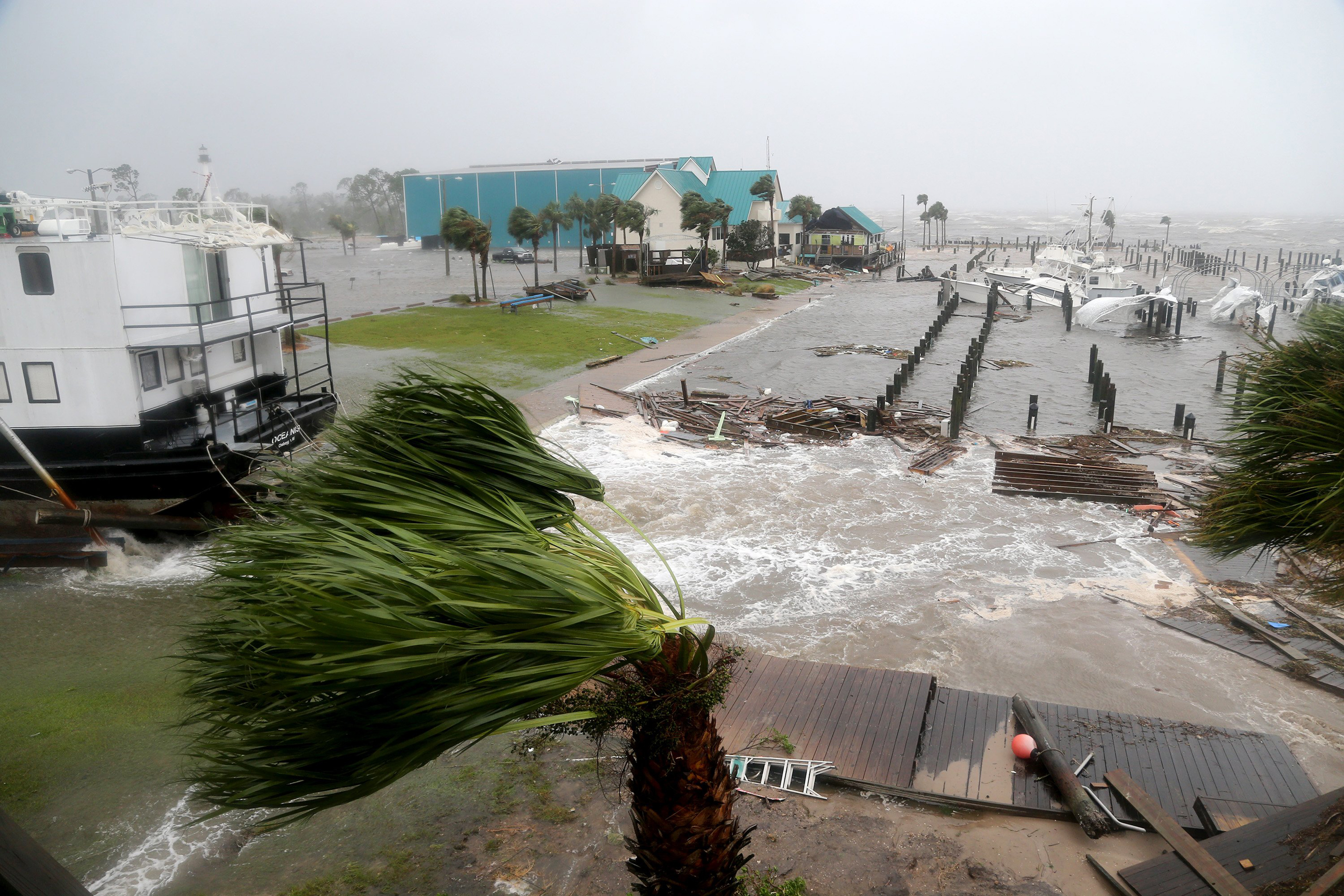 Boats lay sunk and damaged at the Port St. Joe Marina in the Florida Panhandle on Oct. 10 after Hurricane Michael made landfall near Mexico Beach. (Douglas R. Clifford—Tampa Bay Times/ZUMA Wire)