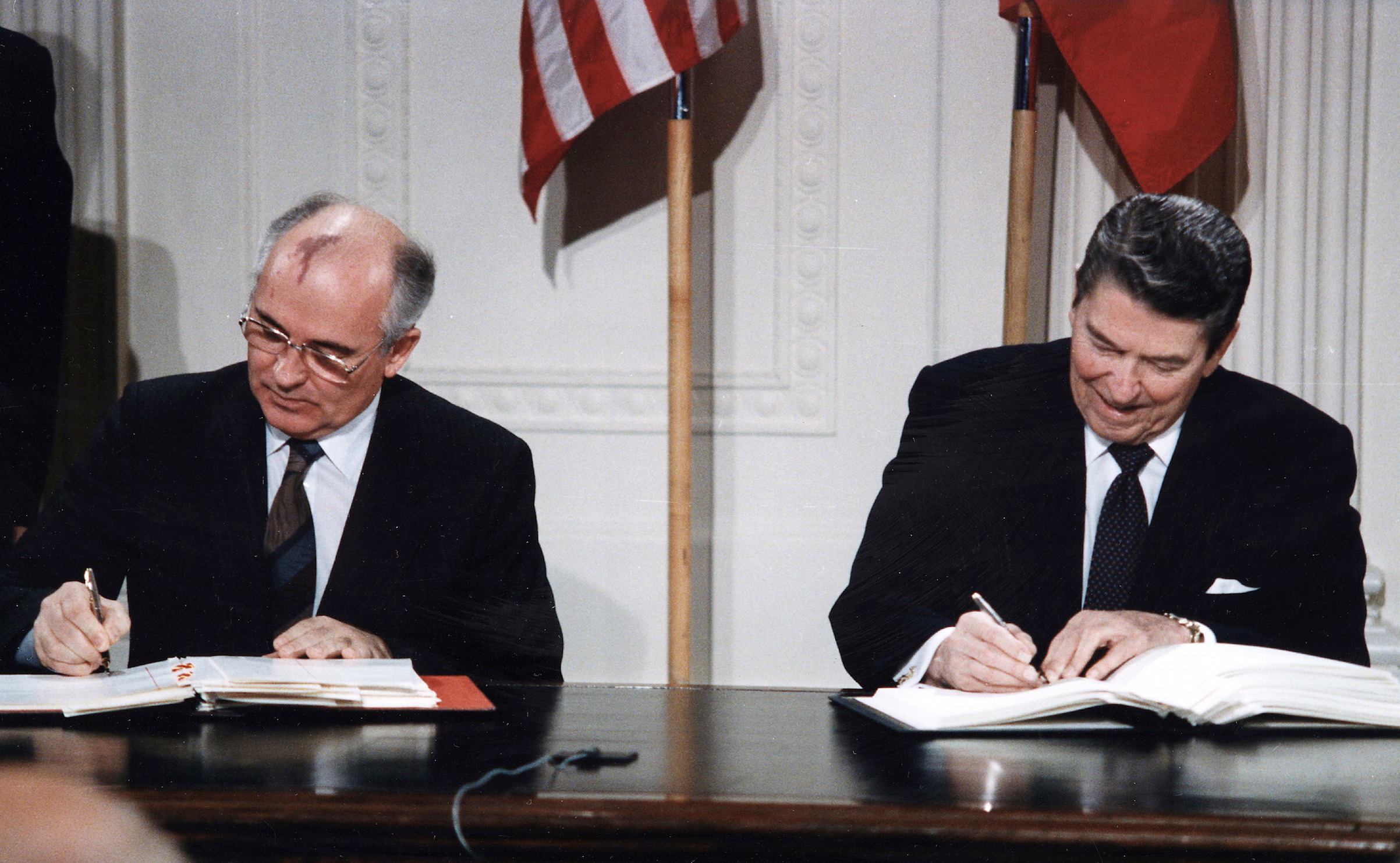 U.S. President Ronald Reagan and Soviet General Secretary Mikhail Gorbachev signing the INF Treaty in the East Room at the White House in 1987. (Universal History Archive/Getty Images)