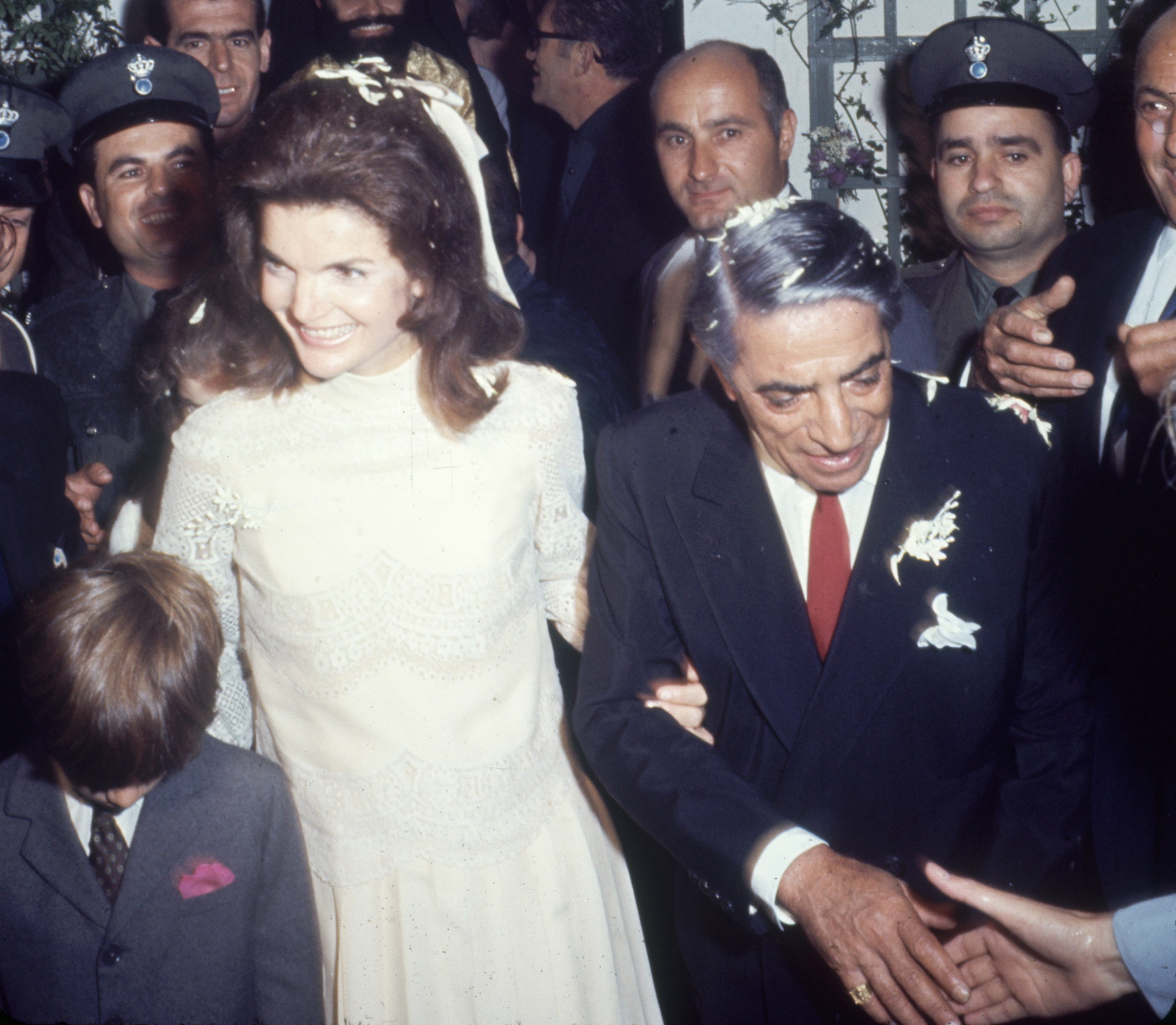 after their wedding in Scorpios, Greece on Oct. 20, 1968. Kennedy's son, John Kennedy Jr. is at left, fore. (Bill Ray/Time &amp; Life Pictures—Getty Images Jackie Lee Bouvier Kennedy Onassis and husband Aristotle Onassis right)