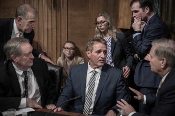 GOP Senators surround Senator Jeff Flake, who slowed Kavanaughâ€™s confirmation after Ford testified