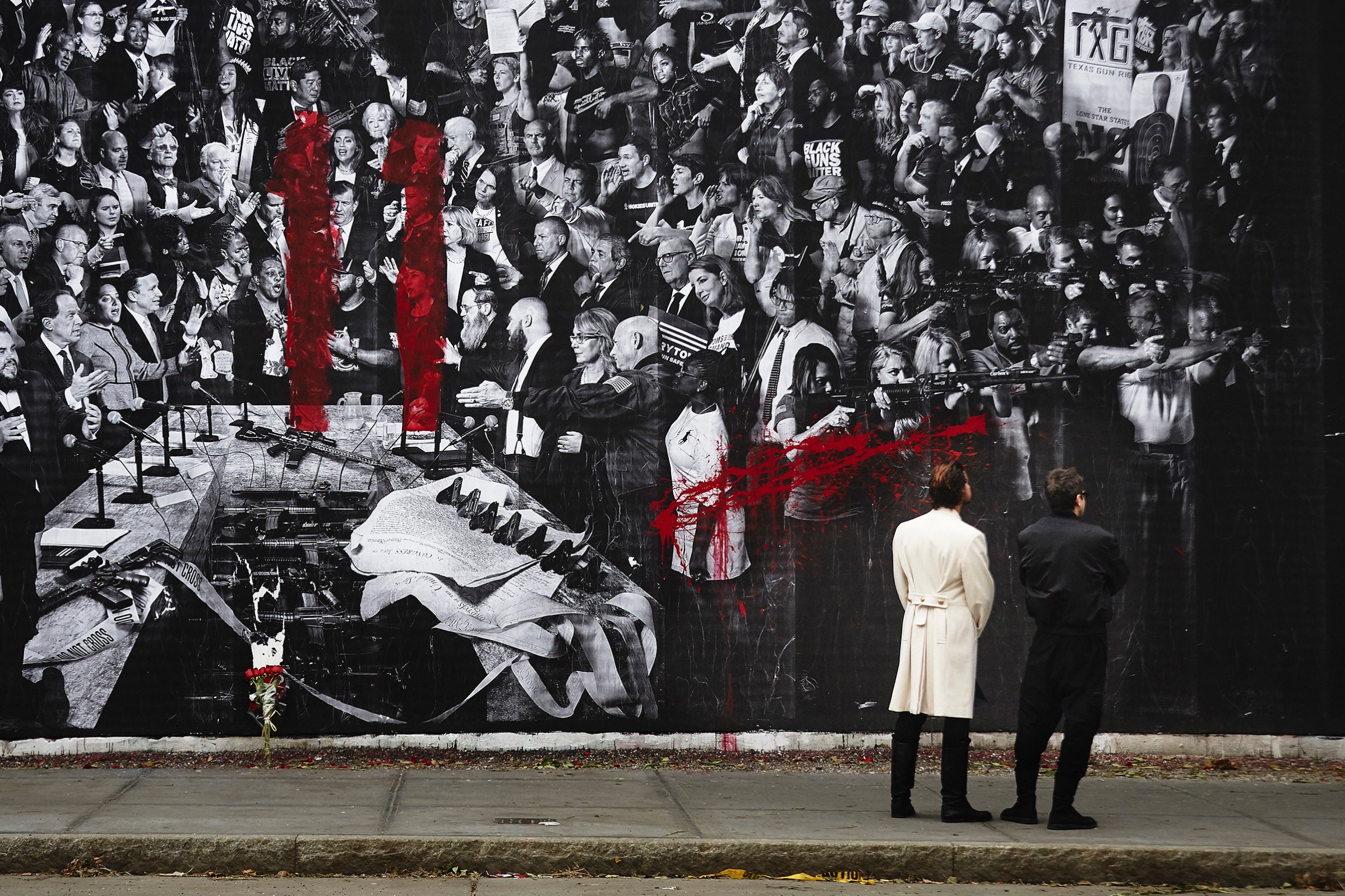 A red spray painted number 11, an apparent reference to the individuals slain in Pittsburgh, is seen on the "Guns in America" mural created by TIME and the artist JR on the Houston Bowery Wall in New York City.
