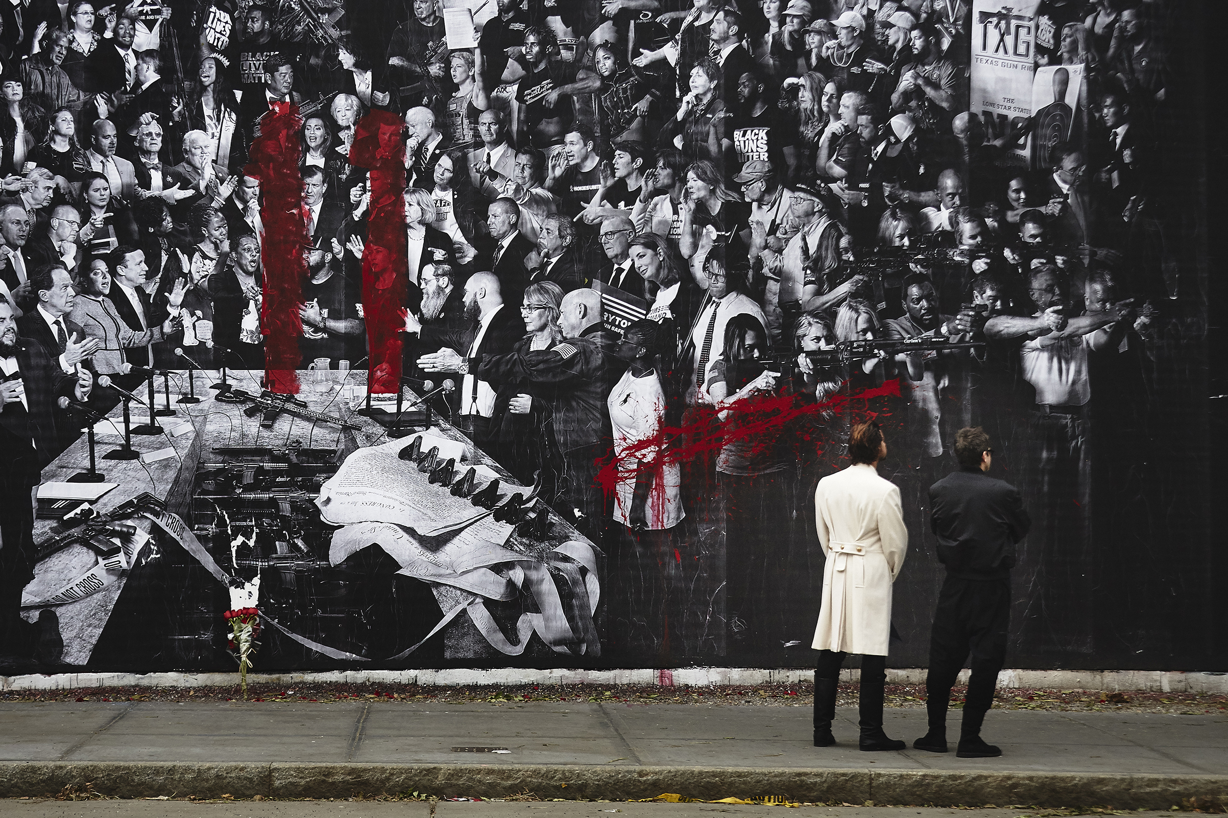 A red spray painted number 11, an apparent reference to the individuals slain in Pittsburgh, is seen on the "Guns in America" mural created by TIME and the artist JR on the Houston Bowery Wall in New York City. (Andres Kudacki for TIME)
