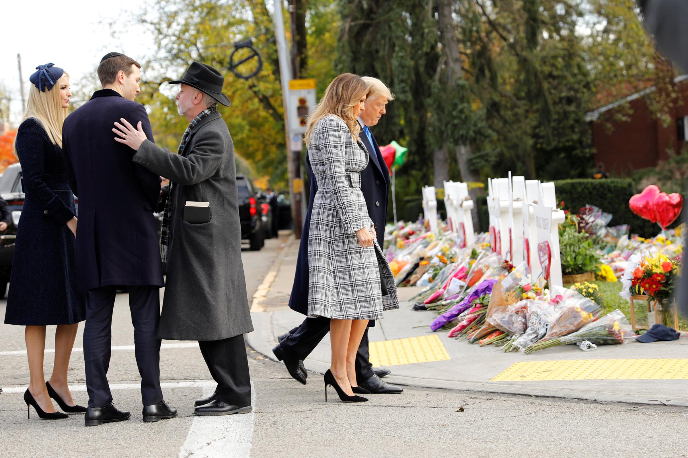 White House senior advisers Jarod Kushner and Ivanka Trump speak with Rabbi Jeffrey Myers as President Donald Trump and first lady Melania Trump pay their respects outside the Tree of Life synagogue in Pittsburgh, Oct. 30.