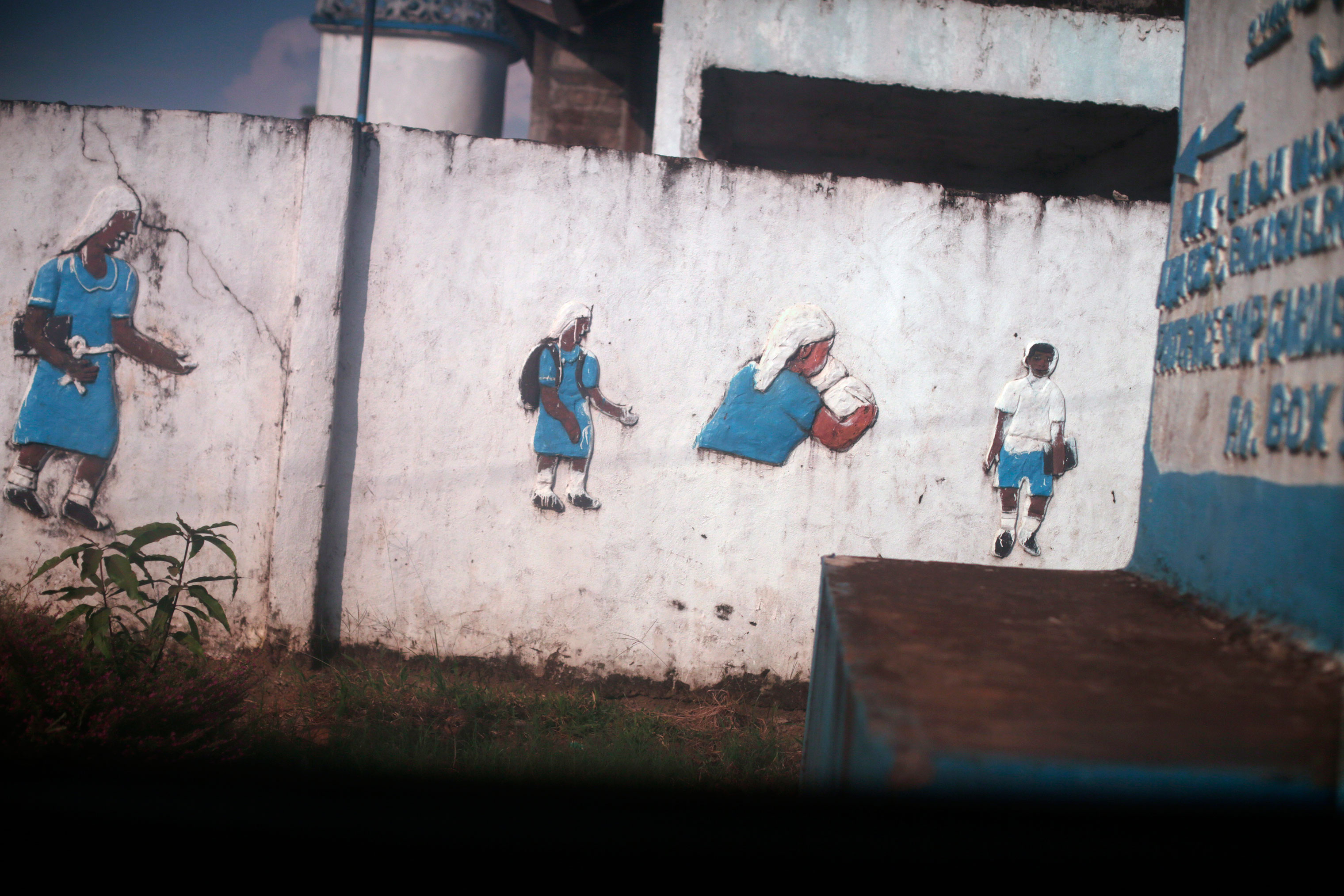 Paintings on a school wall in Monrovia. (Kathleen Flynn, special to ProPublica)
