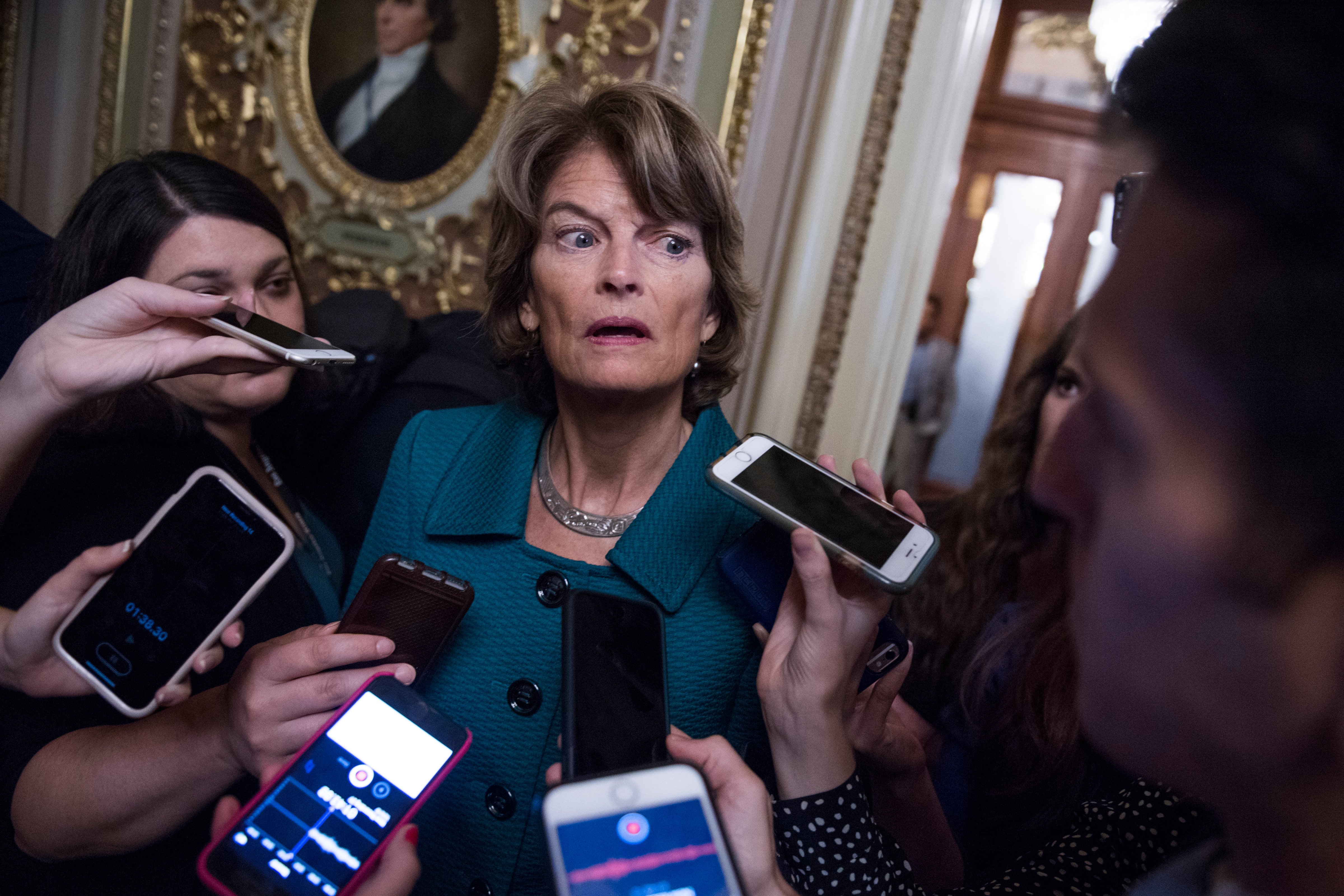 Alaska Sen. Lisa Murkowski talks with the media in the Capitol after voting "no" on a cloture that advanced the Supreme Court nomination of Brett Kavanaugh to a final vote on Oct. 5, 2018. (Tom Williams—CQ-Roll Call/Getty Images)