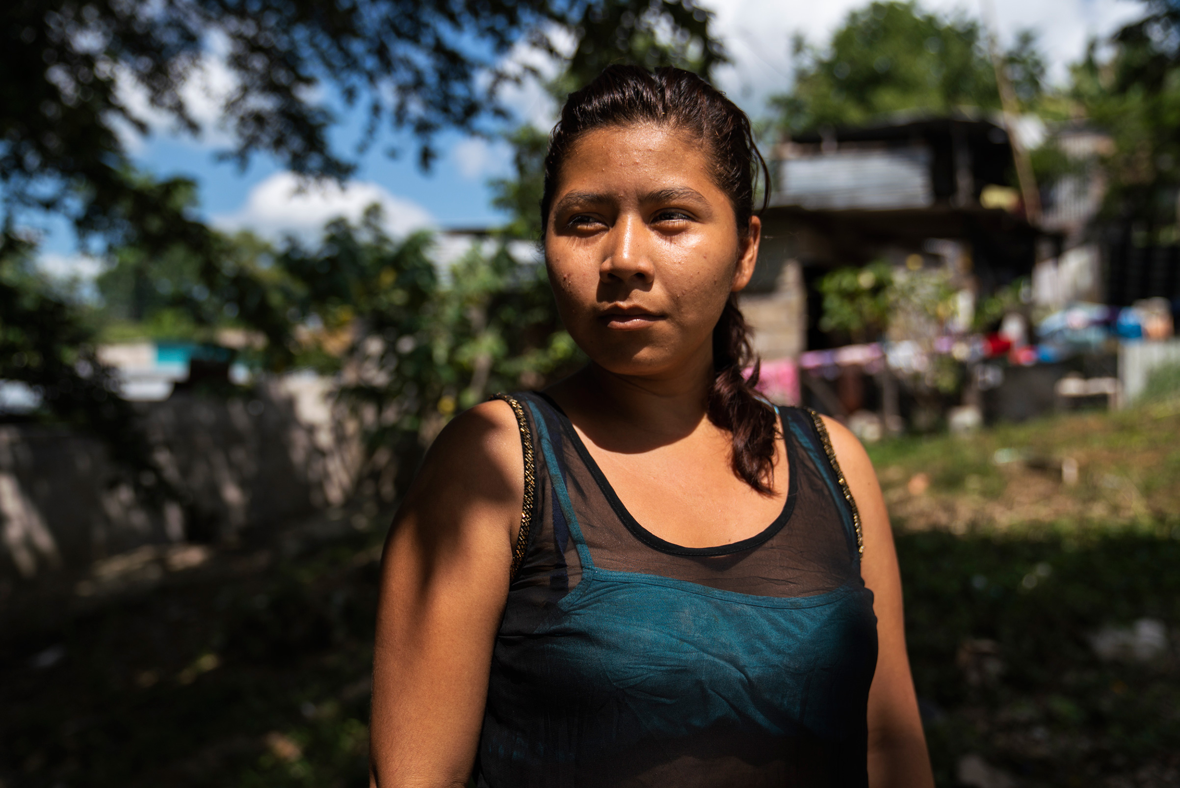 Honduran migrant Norma Leticia López, 21, on Oct. 26, in front of the a migrant shelter near Palenque, Chiapas. She left her country four days before leaving behind two kids. Norma used to work at a bakery and says she did not make enough money to support her children; she says she could only afford rice and beans. “I want for my kids to have a better life, an education," she adds. "A mother would do anything for her kids.” (Veronica G. Cardenas for TIME)