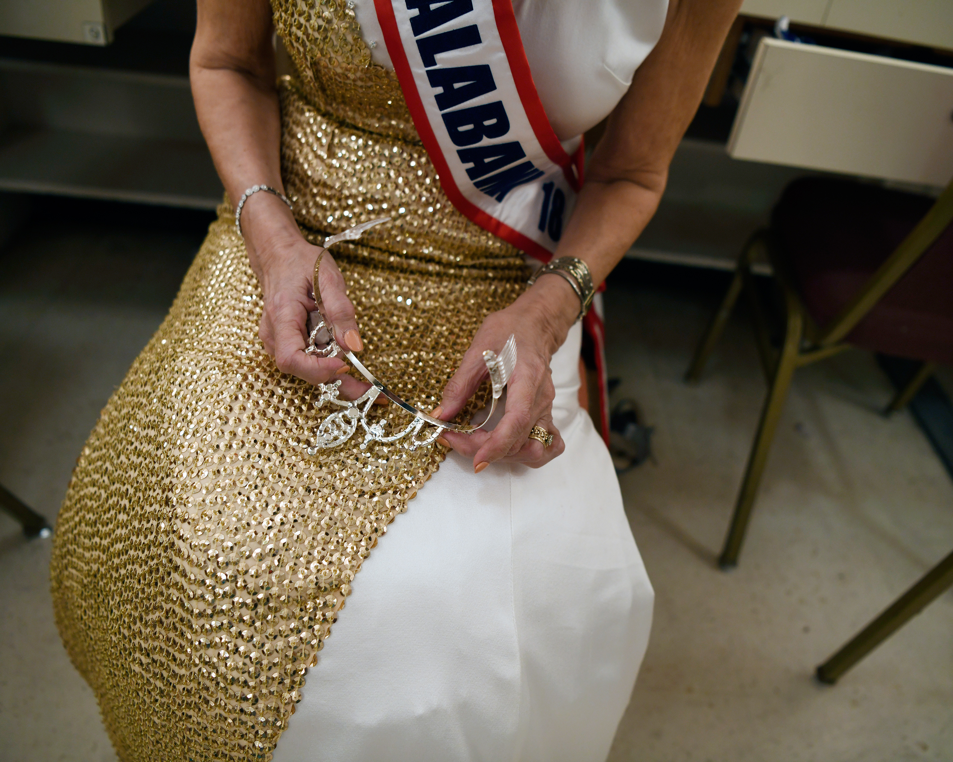Georgia Lee, Ms. Alabama, holds her crown in the dressing room between pageant acts. (Rosa Polin for TIME)