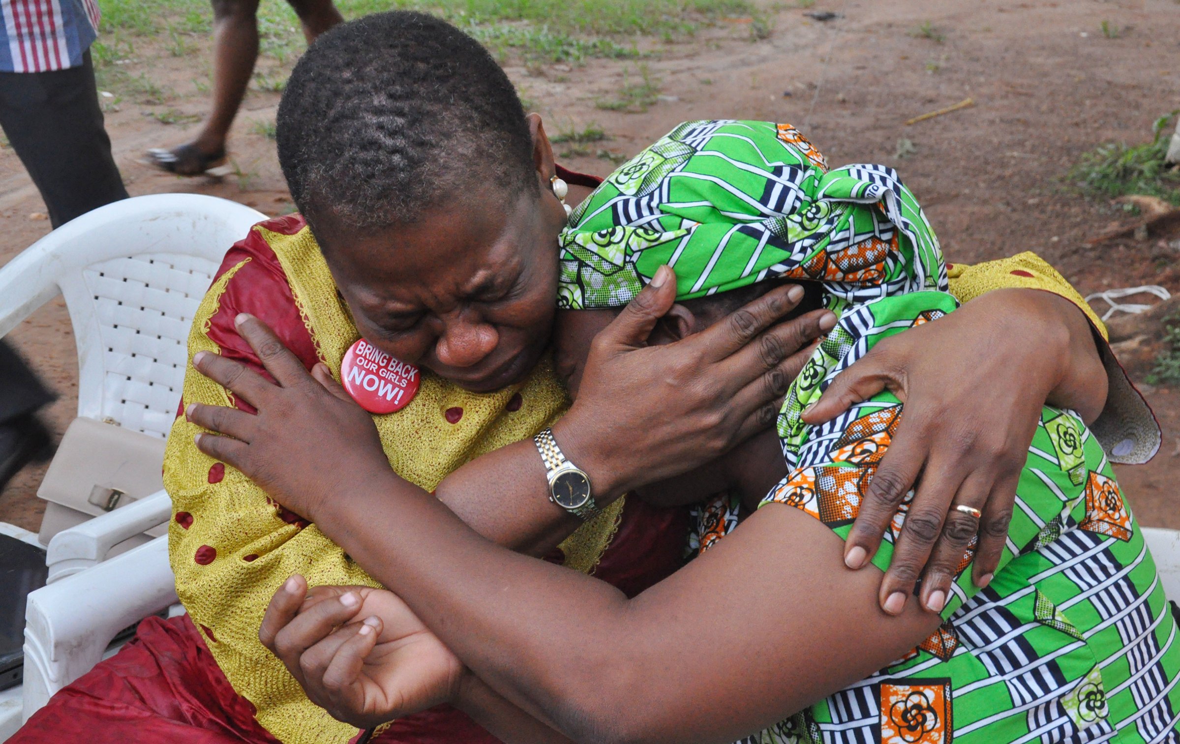 Ezekwesili comforts the mother of a girl kidnapped by Boko Haram in Abuja on Aug. 14, 2016