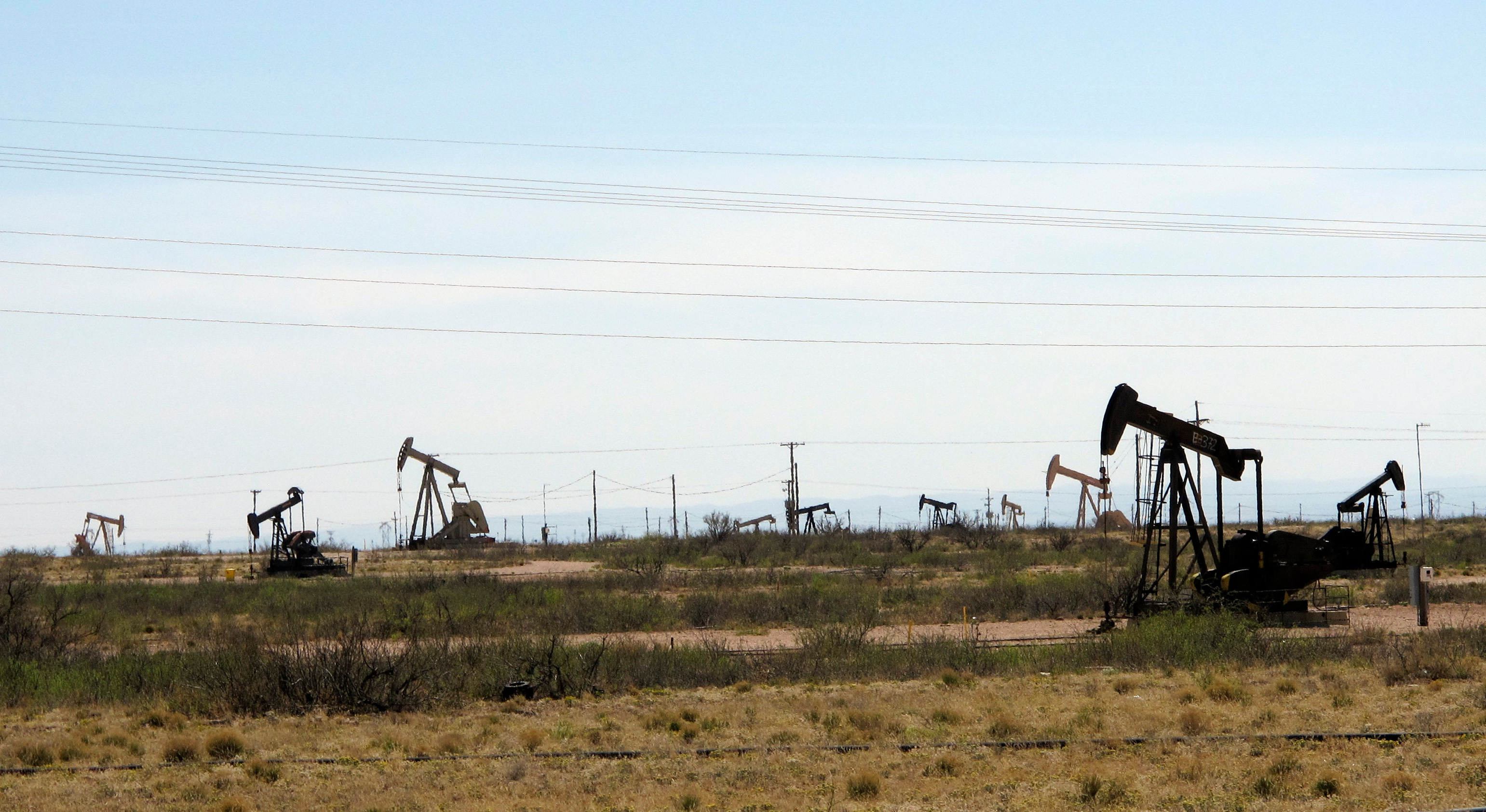 This photo shows oil rigs in the Loco Hills field in Eddy County, near Artesia, New Mexico, on April 9, 2018. This is one of the most active regions of the Permian Basin, the home of the U.S. oil boom. (Jeri Clausing—AP/REX/Shutterstock)