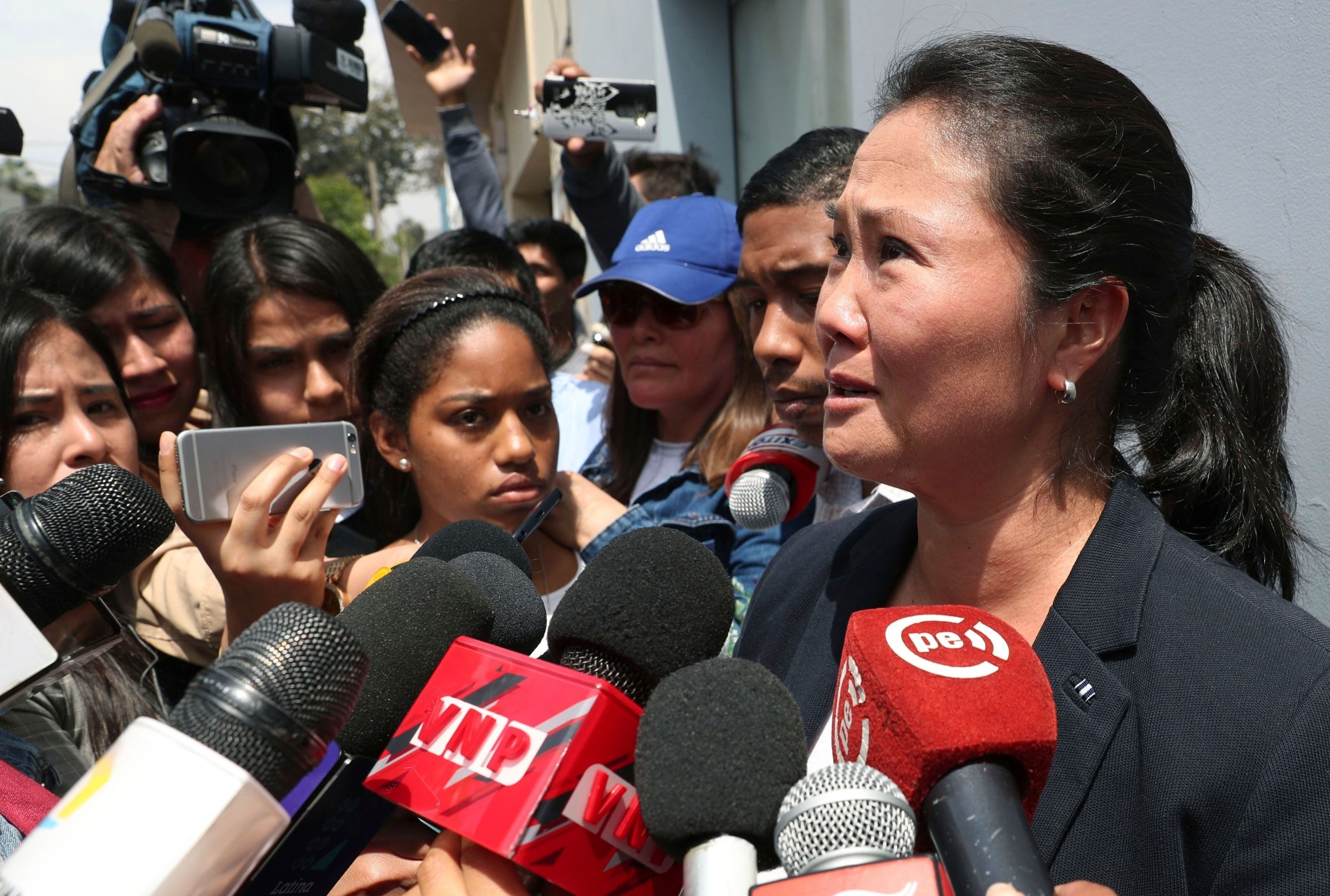 Fujimori speaks to reporters in Peru