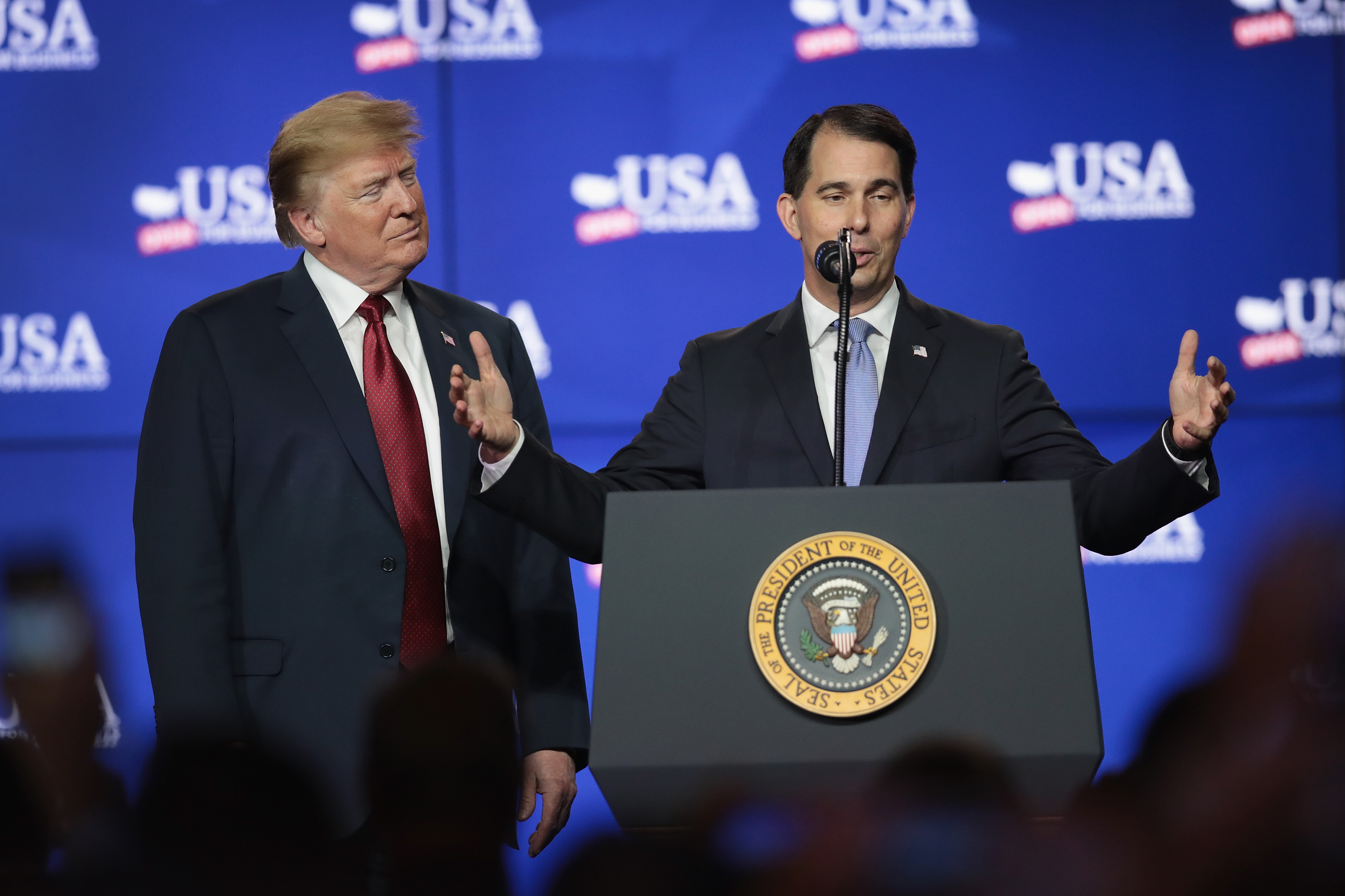 President Donald Trump (L) and Scott Walker, governor of Wisconsin, participate in a groundbreaking ceremony for the $10 billion Foxconn factory complex on June 28, 2018 in Mt. Pleasant, Wisconsin. (Scott Olson—Getty Images)