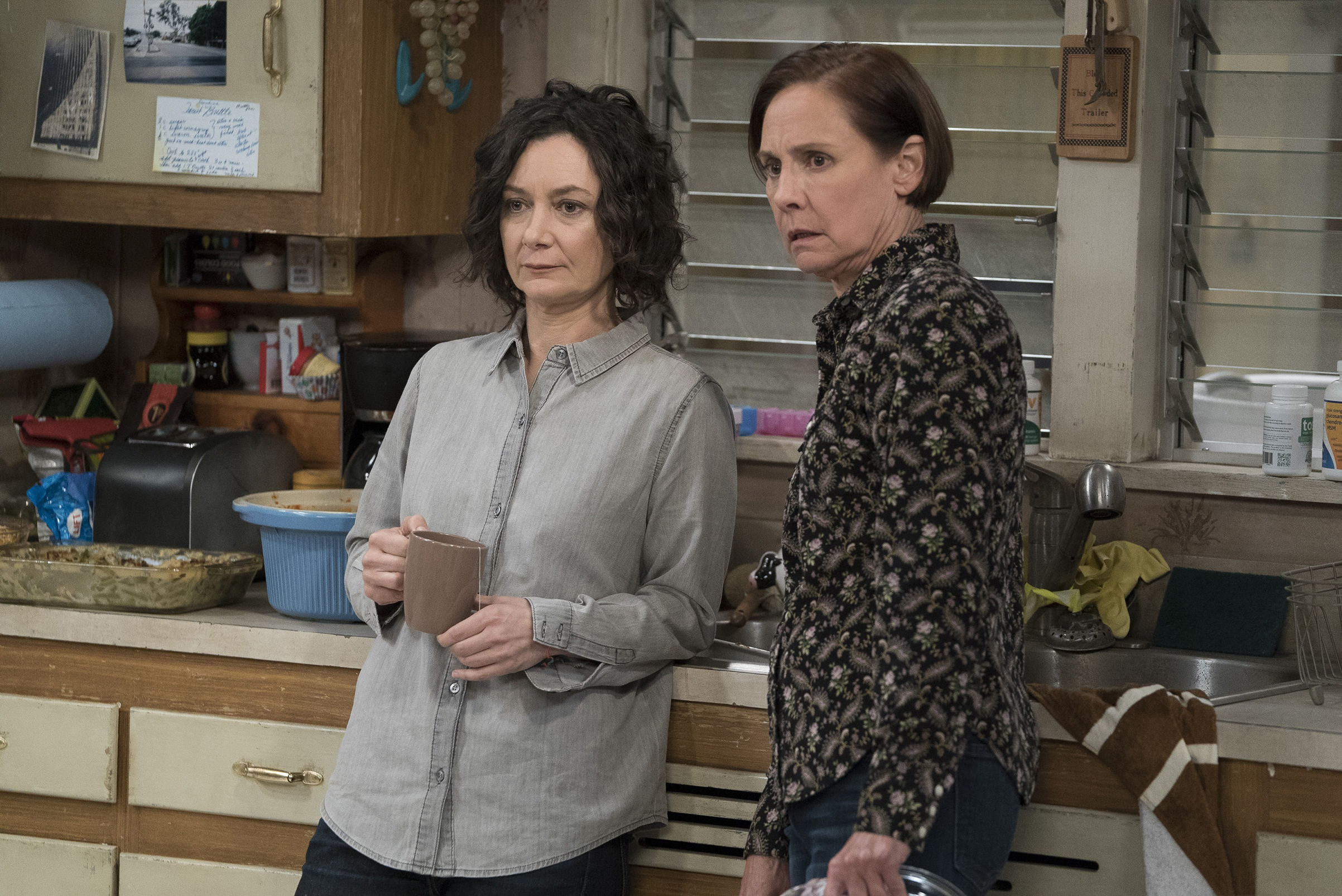 Darlene (Sara Gilbert) and Jackie (Laurie Metcalf) cope with a conspicuous absence on The Conners (ABC)