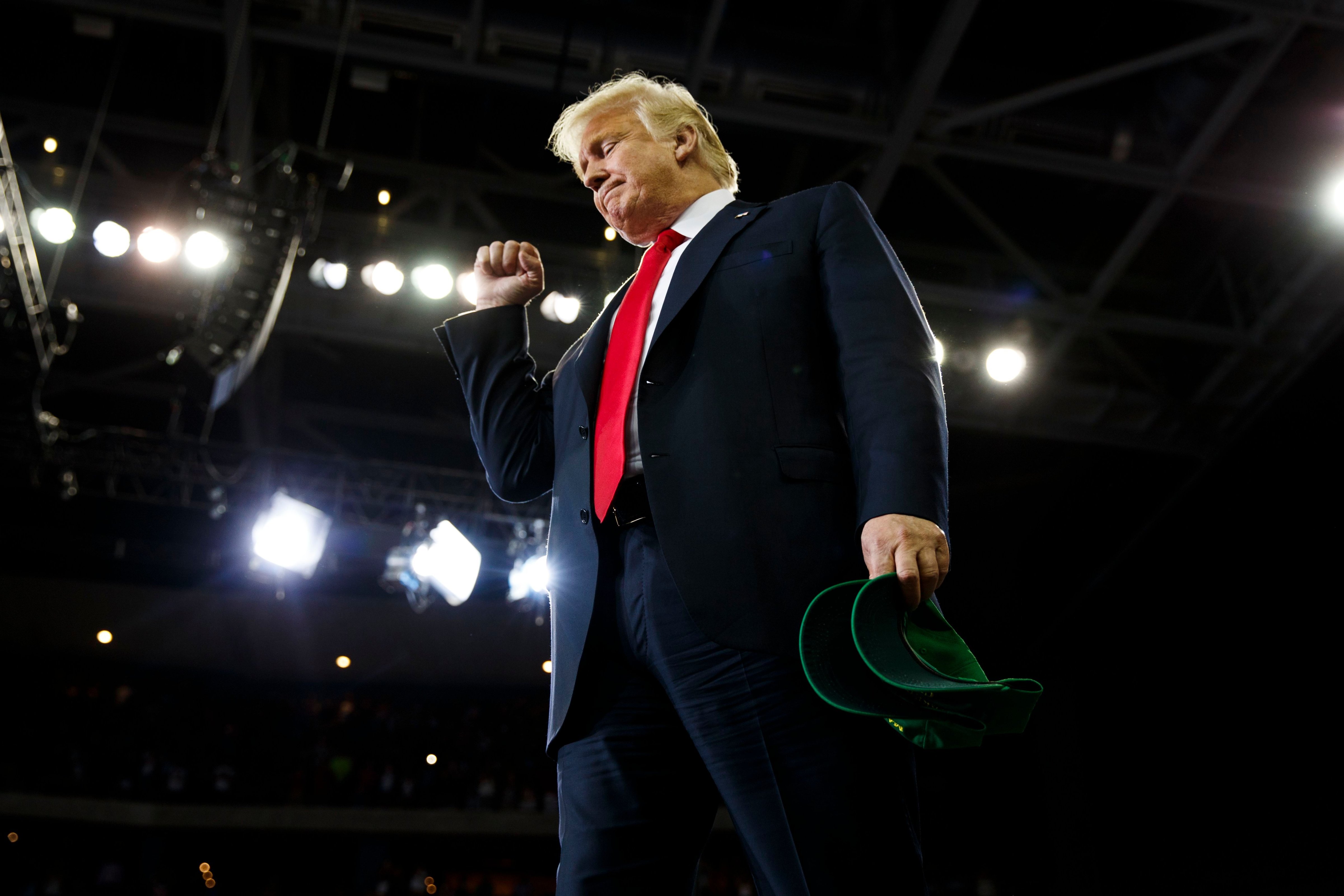 President Donald Trump pumps his fist as he arrives to a campaign rally at the Ford Center, in Evansville, Ind., on Aug. 30, 2018. (Evan Vucci—AP/Shutterstock)