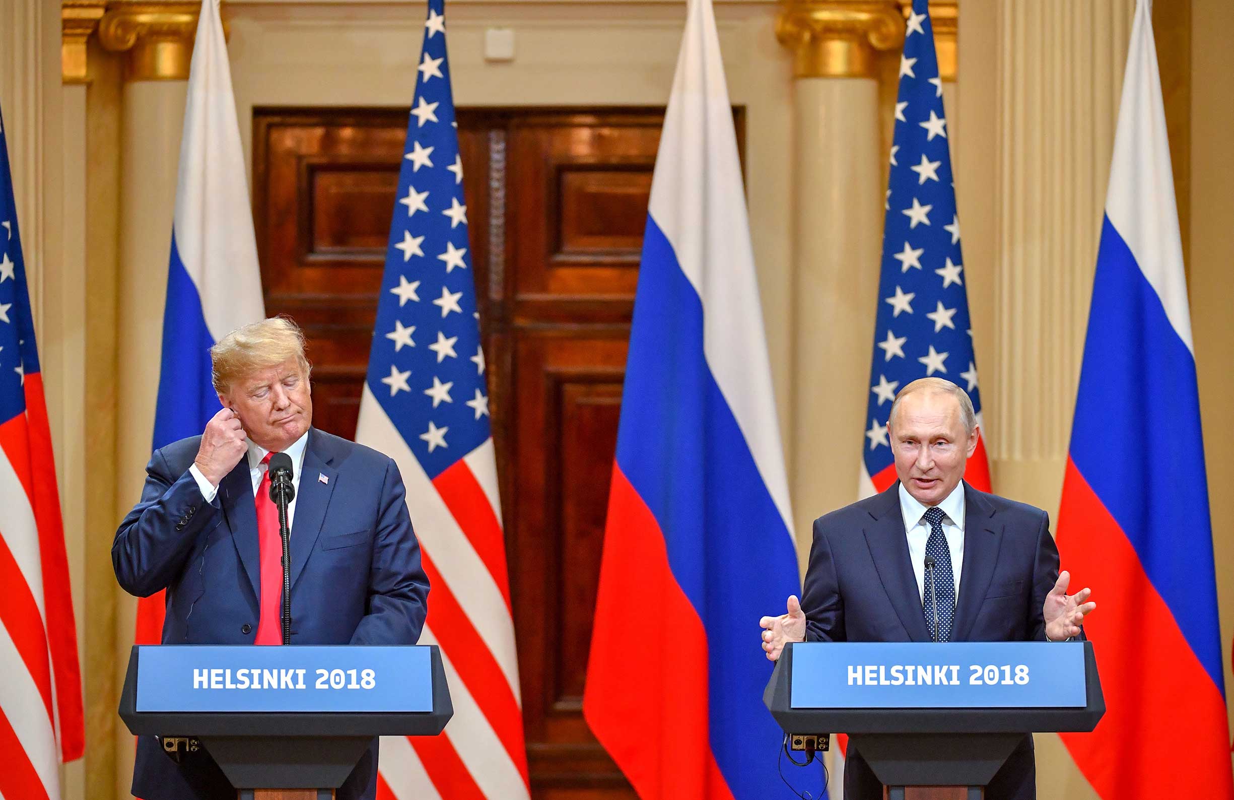 US President Donald Trump and Russia's President Vladimir Putin attend a joint press conference after a meeting at the Presidential Palace in Helsinki, on July 16, 2018. (Yuri Kadobnov—AFP/Getty Images)