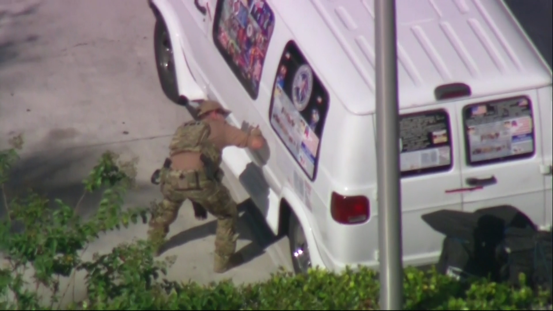 Authorities are seen in Plantation, Florida taking a man into custody in connection to the mailed package bombs. (Photo Courtesy WPLG)