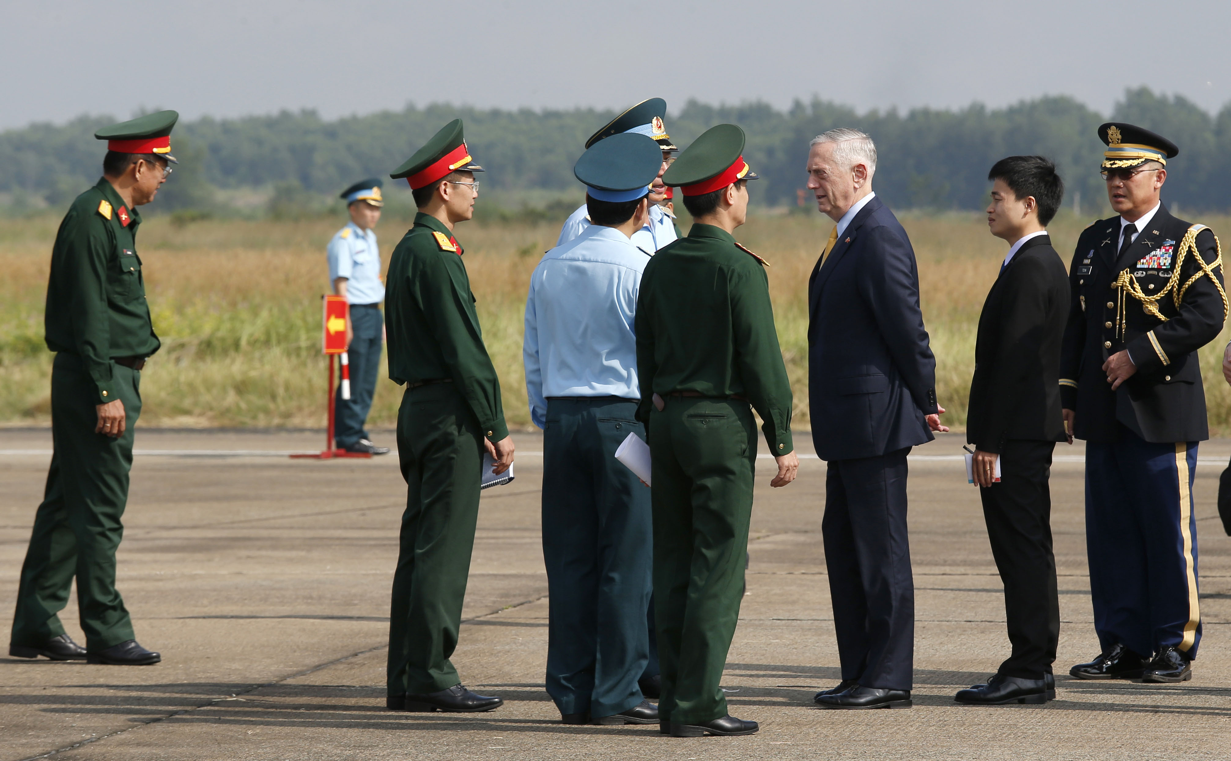 U.S. Defense Secretary Jim Mattis talks to Vietnamese military officials as he visits Bien Hoa airbase, where the US army stored the defoliant Agent Orange during the Vietnam War, in Bien Hoa city, on the outskirts of Ho Chi Minh city, on October 17, 2018. (KHAM&mdash;AFP/Getty Images)