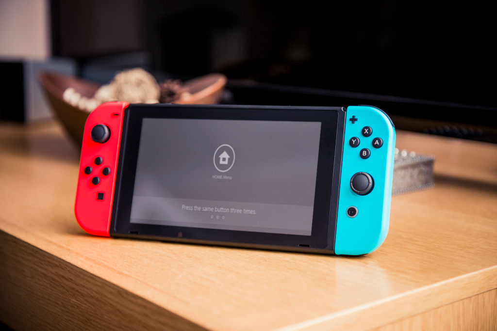 A Nintendo Switch home console fitted with Joy Con controllers photographed on a tabletop, taken on March 7, 2017. (Future Publishing&mdash;Future Publishing)