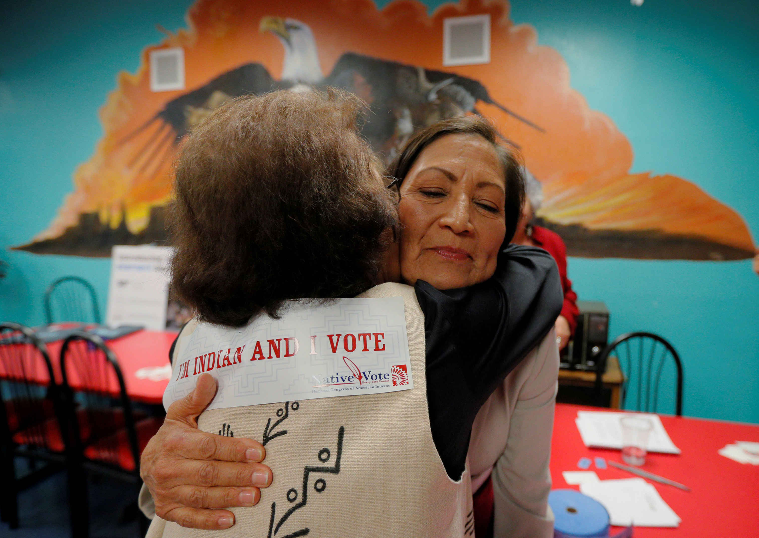 U.S. Democratic Congressional candidate Deb Haaland, who is trying to become the first Native American woman in the U.S. House of Representatives, hugs Dottie Tiger at a Native Vote Celebration on Election Night in Albuquerque, N.M. (Brian Snyder—Reuters)