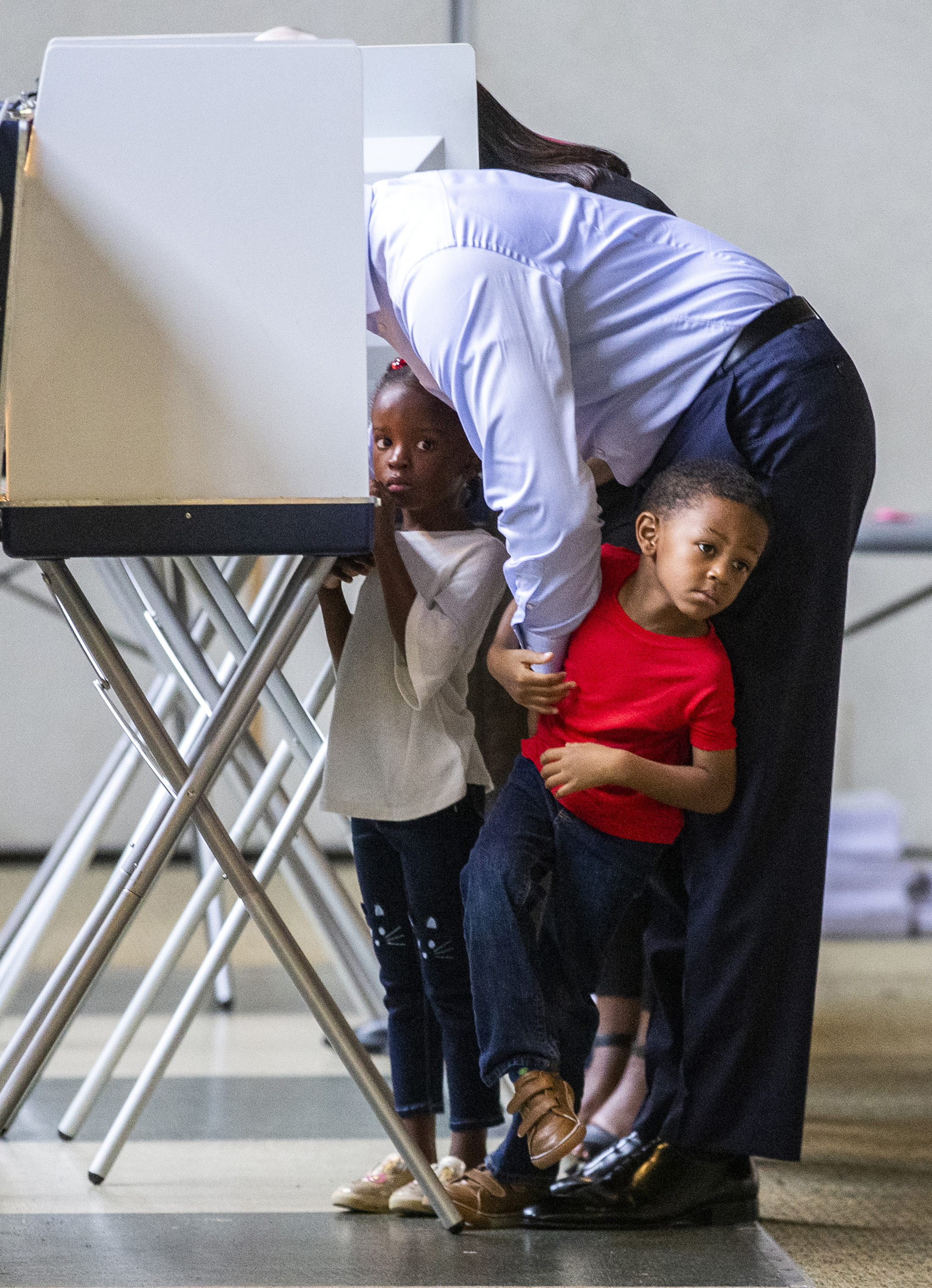Tallahassee mayor and Democratic gubernatorial candidate Andrew Gillum casts his ballot with his four-year-old twins Caroline, left, and Jackson in Tallahassee, Fla. (Mark Wallheiser—Getty Images)