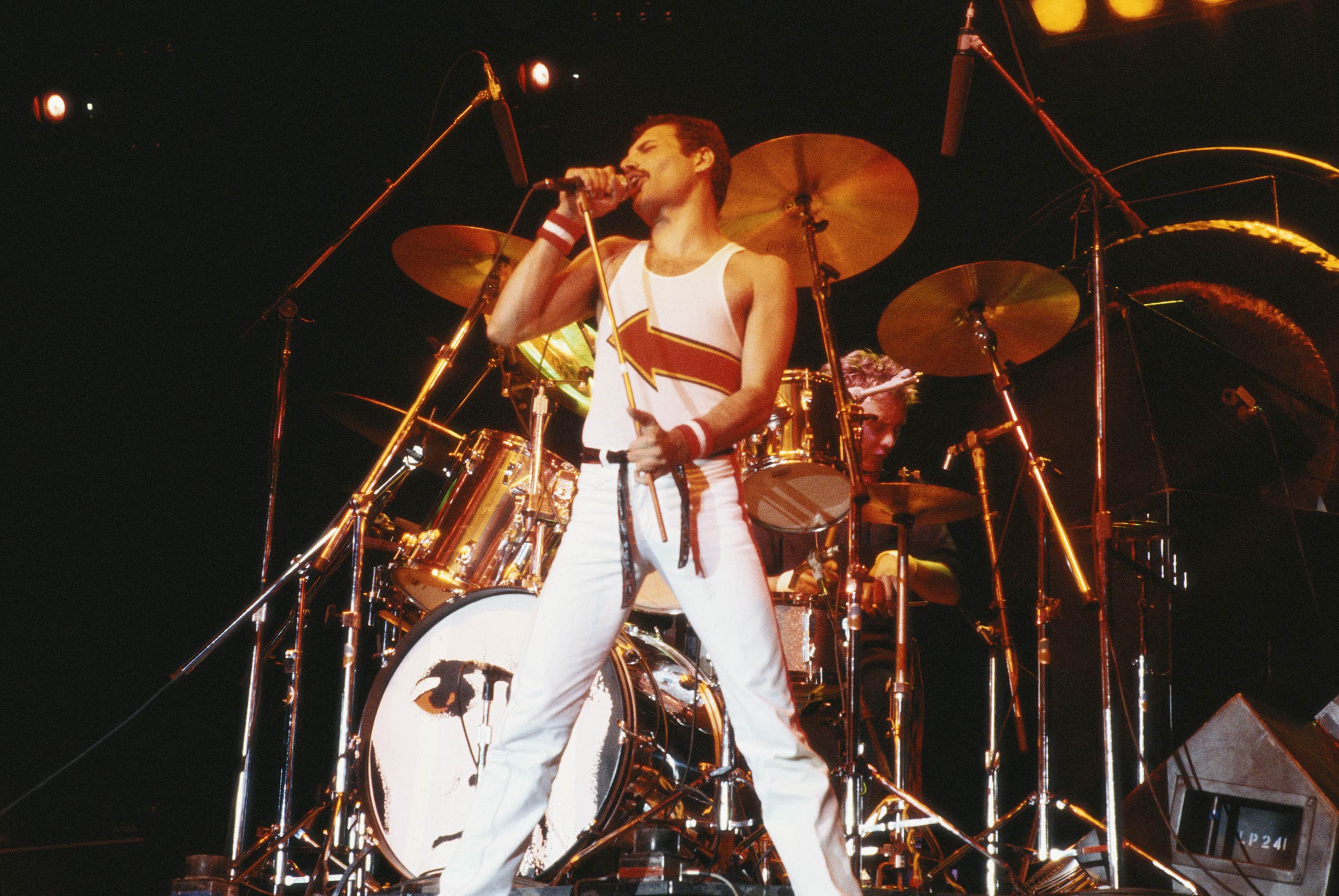 Queen singer Freddie Mercury performing at the band's concert at the National Bowl in Milton Keynes, England, on Jun. 5, 1982. (Fox Photos/Hulton Archive—Getty Images)