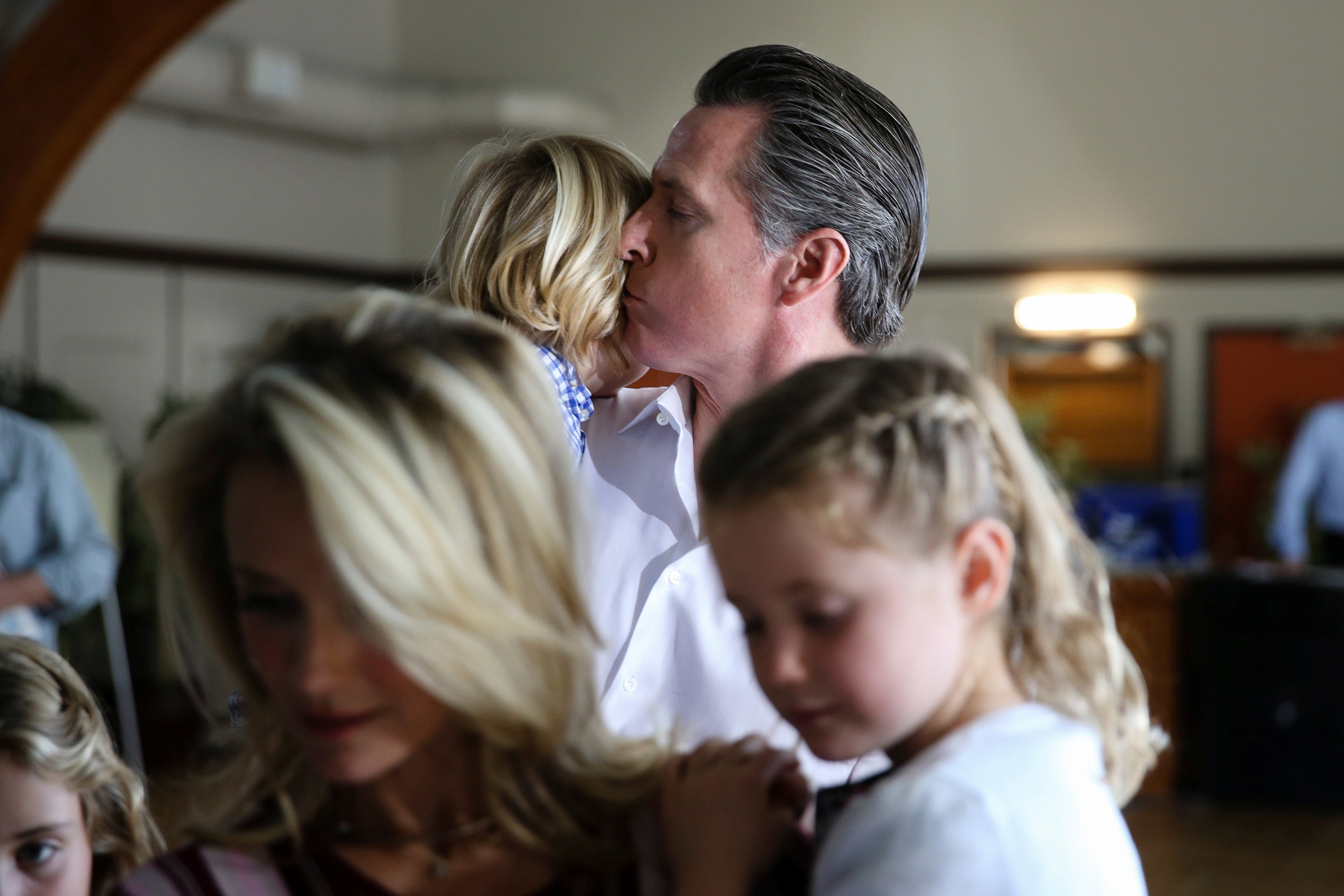 California Democratic gubernatorial candidate Gavin Newsom kisses his son while waiting for his wife to receive her ballot in Larkspur, Calif. (Elijah Nouvelage—Reuters)
