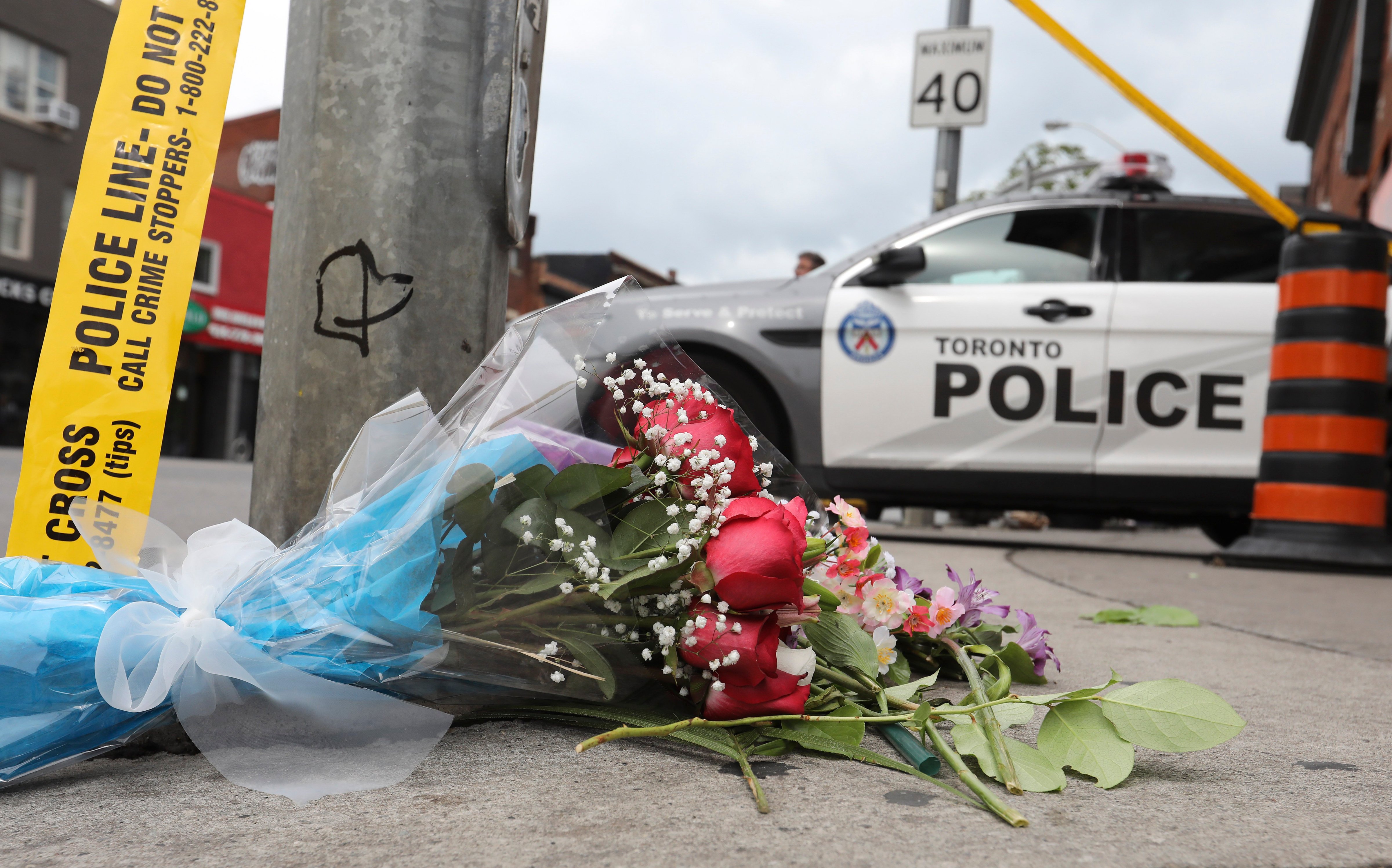 A makeshift memorial commemorates a mass shooting that killed two on Danforth Avenue in Toronto, Ontario on July 22, 2018. (Richard Lautens&mdash;Toronto Star/Getty Images)