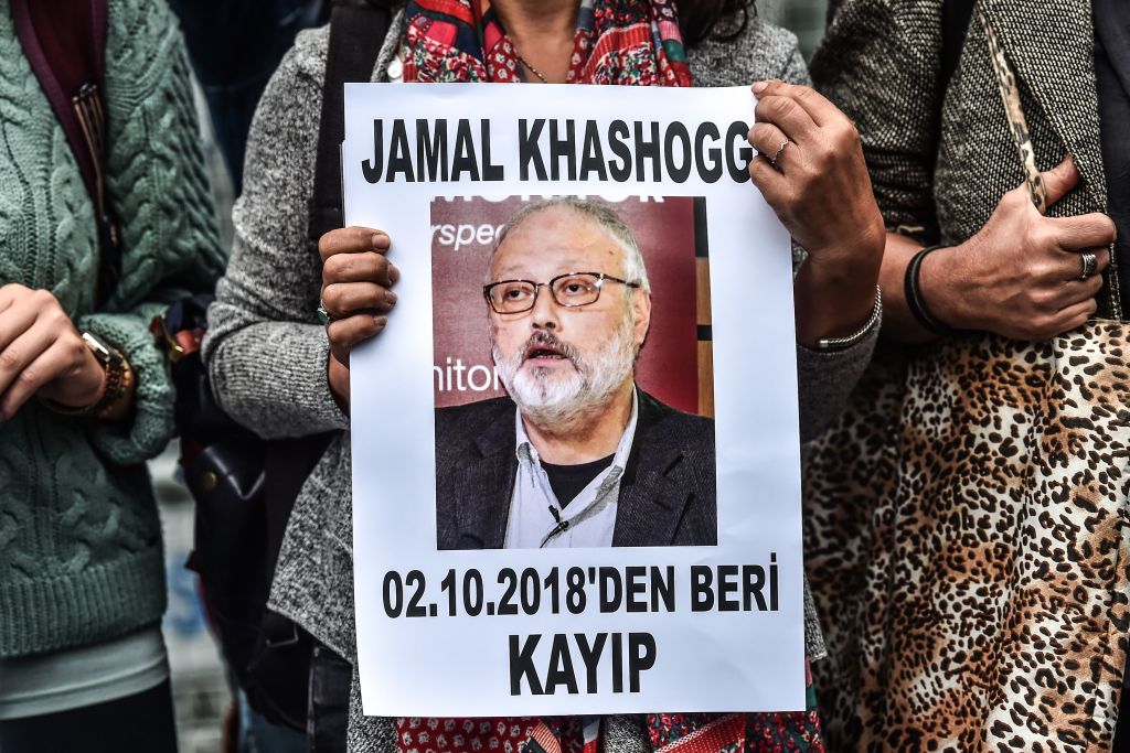 A woman holds a portrait of missing journalist and Riyadh critic Jamal Khashoggi reading "Jamal Khashoggi is missing since October 2" during a demonstration in front of the Saudi Arabian consulate in Istanbul on Oct. 9, 2018. (Ozan Kose—AFP/Getty Images)