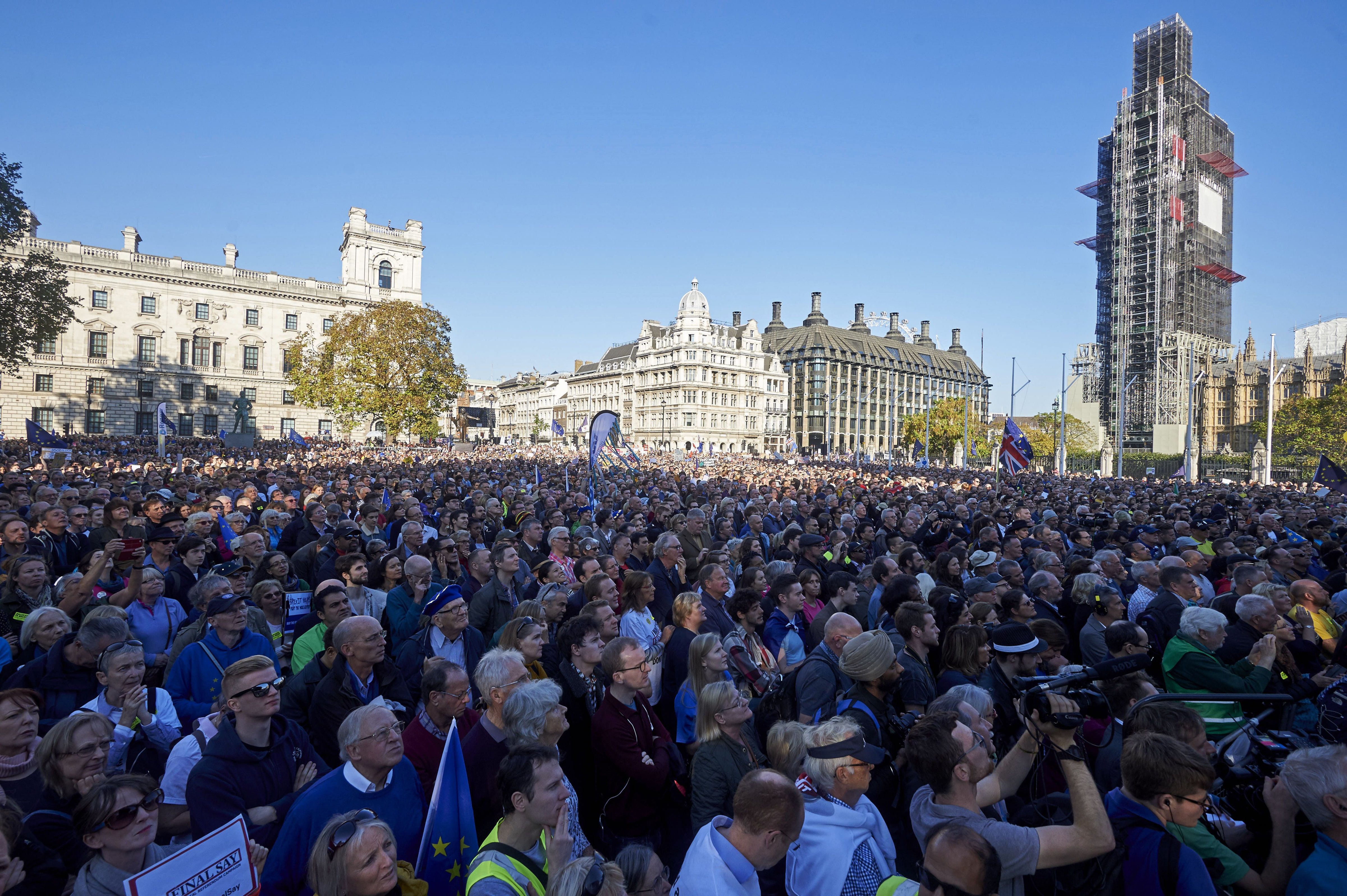 OCT. 20: Demonstrators listen to speeches after taking part in the "People's Vote" march. (NIKLAS HALLE'N—AFP/Getty Images)
