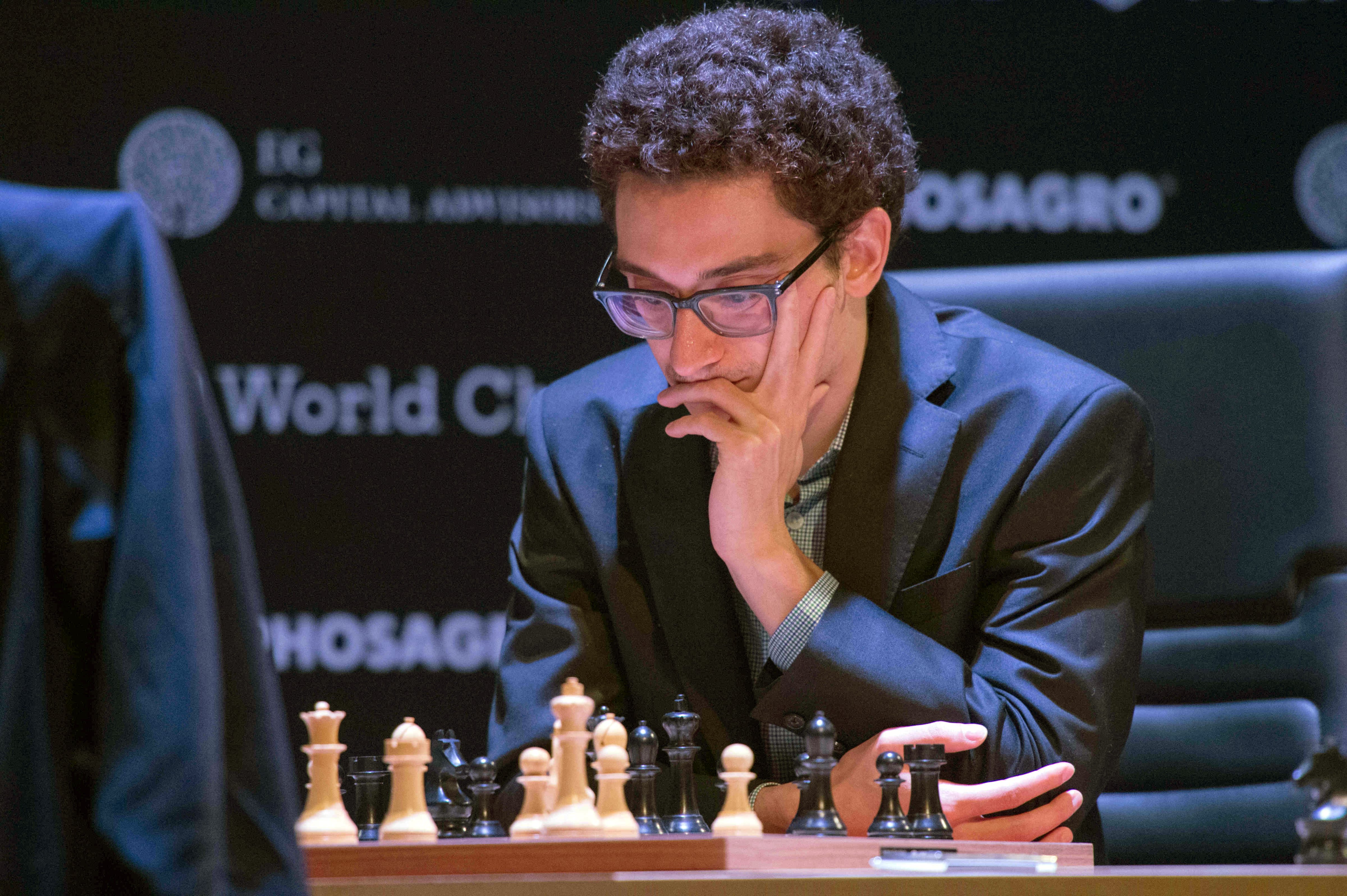 Fabiano Caruana, a US-American and Italian chess grand master, and Grischuk (not pictured), chess grand master of Russia, playing at their boards at the "FIDE World Chess Candidates Tournament" in March 2018. ( (picture alliance&mdash;picture alliance via Getty Image)