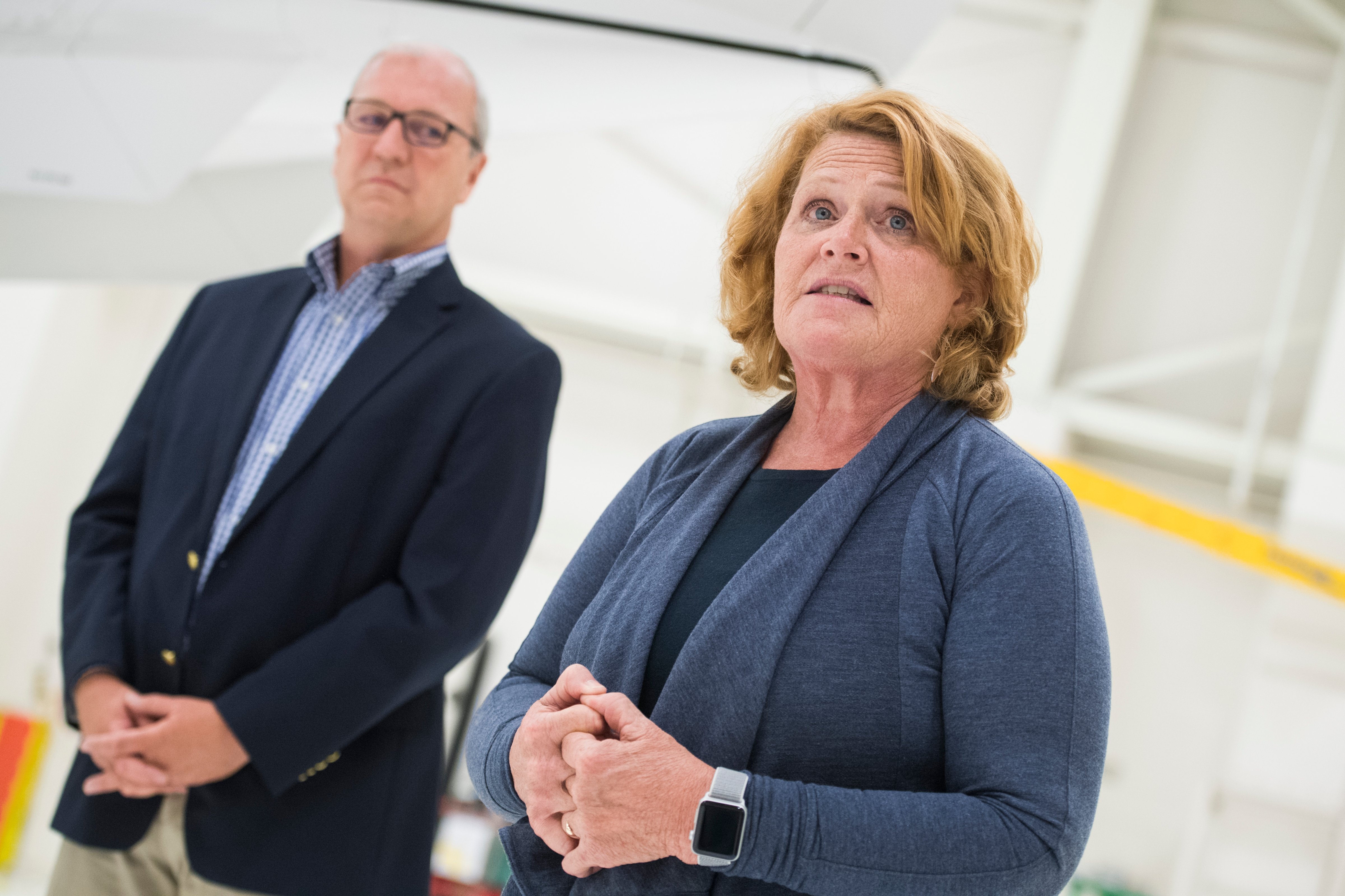 North Dakota Sen. Heidi Heitkamp, a Democrat, and North Dakota Rep. Kevin Cramer, a Republican, attend an event with National Guardsmen in Bismarck, N.D., on Aug. 17, 2018. (Tom Williams—CQ-Roll Call,Inc./Getty Images)