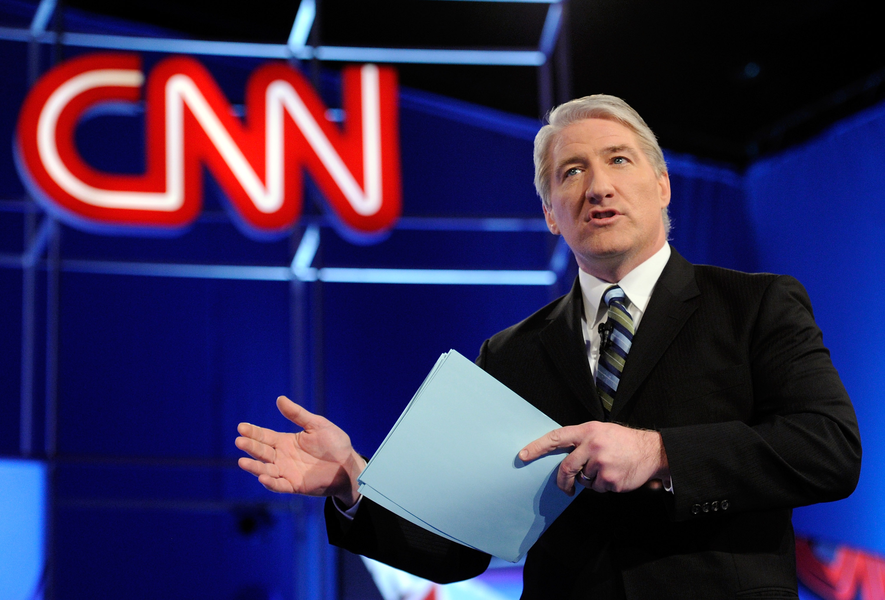 CNN correspondent John King talks to the audience before moderating a debate between Republican presidential candidates on February 22, 2012 in Mesa, Arizona. On Nov. 6, 2018 the CNN correspondent John King was seen walking around aimlessly around the CNN studio during the midterm election. (Ethan Miller—Getty Images)
