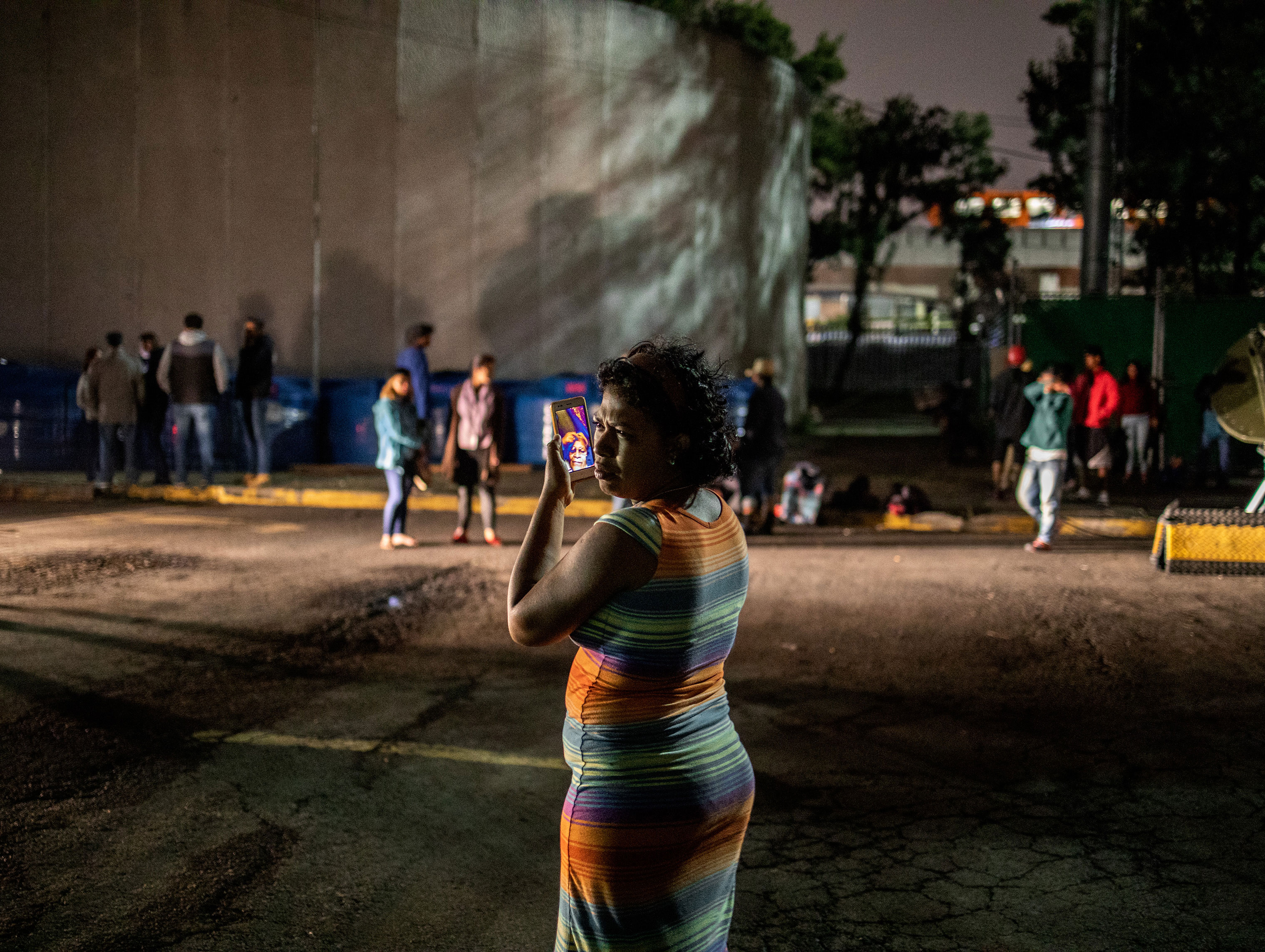 Outside the Jesus Martinez stadium, in Mexico City on Nov. 4, 2018. Martha, 25, from Colón Honduras is a single mother of three young children. "There is no work in my country, there's nothing." She says that she left her country to help her children have a better future. (Jerome Sessini—Magnum Photos for TIME)