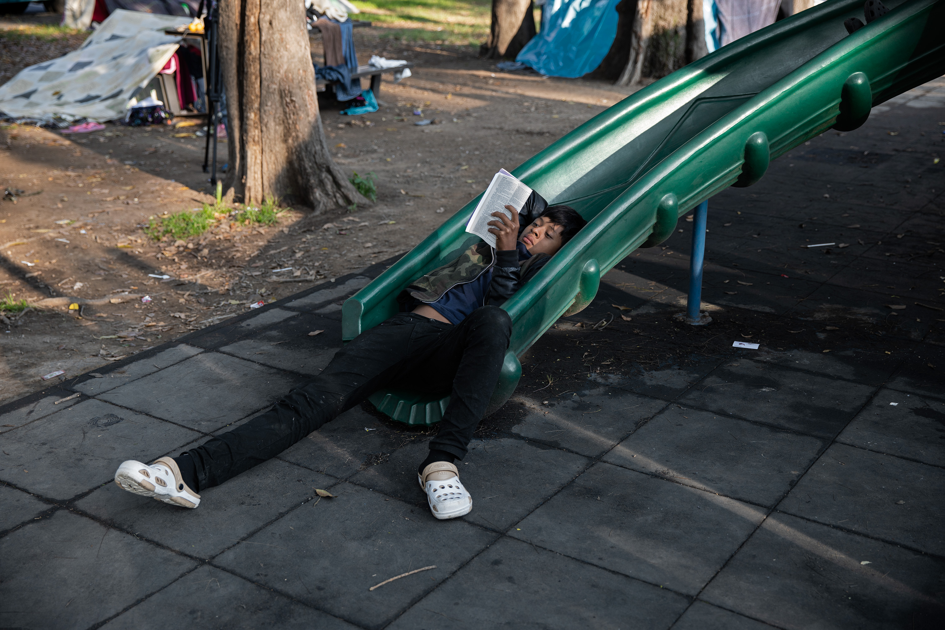 The Jesus Martinez stadium in Mexico City includes several playgrounds where some of the 2,300 minors from the caravan played, rested and read books, Nov. 7, 2018. (Jerome Sessini—Magnum Photos for TIME)