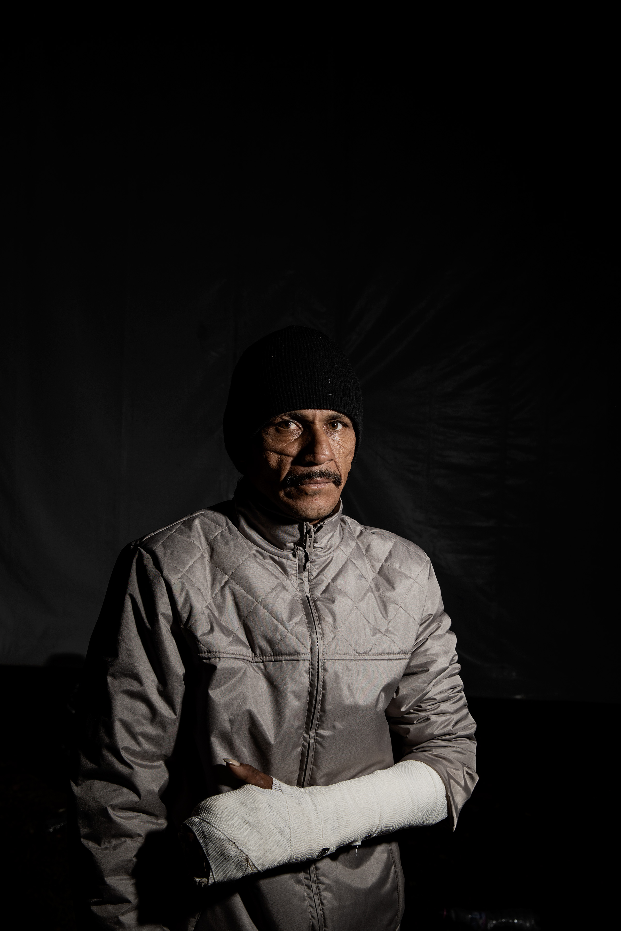 Roberto Vaughan Ordáz, 42, at the Jesus Martinez stadium on Nov. 9, 2018. Ordáz says he first tried to migrate to the US in 2015. When he arrived in Chiapas, he was kidnapped by a gang, shot eight times, cut up with a machete and left for dead. The violence remains in the scars on his face. He decided to travel with the migrant caravan for safety. (Jerome Sessini—Magnum Photos for TIME)
