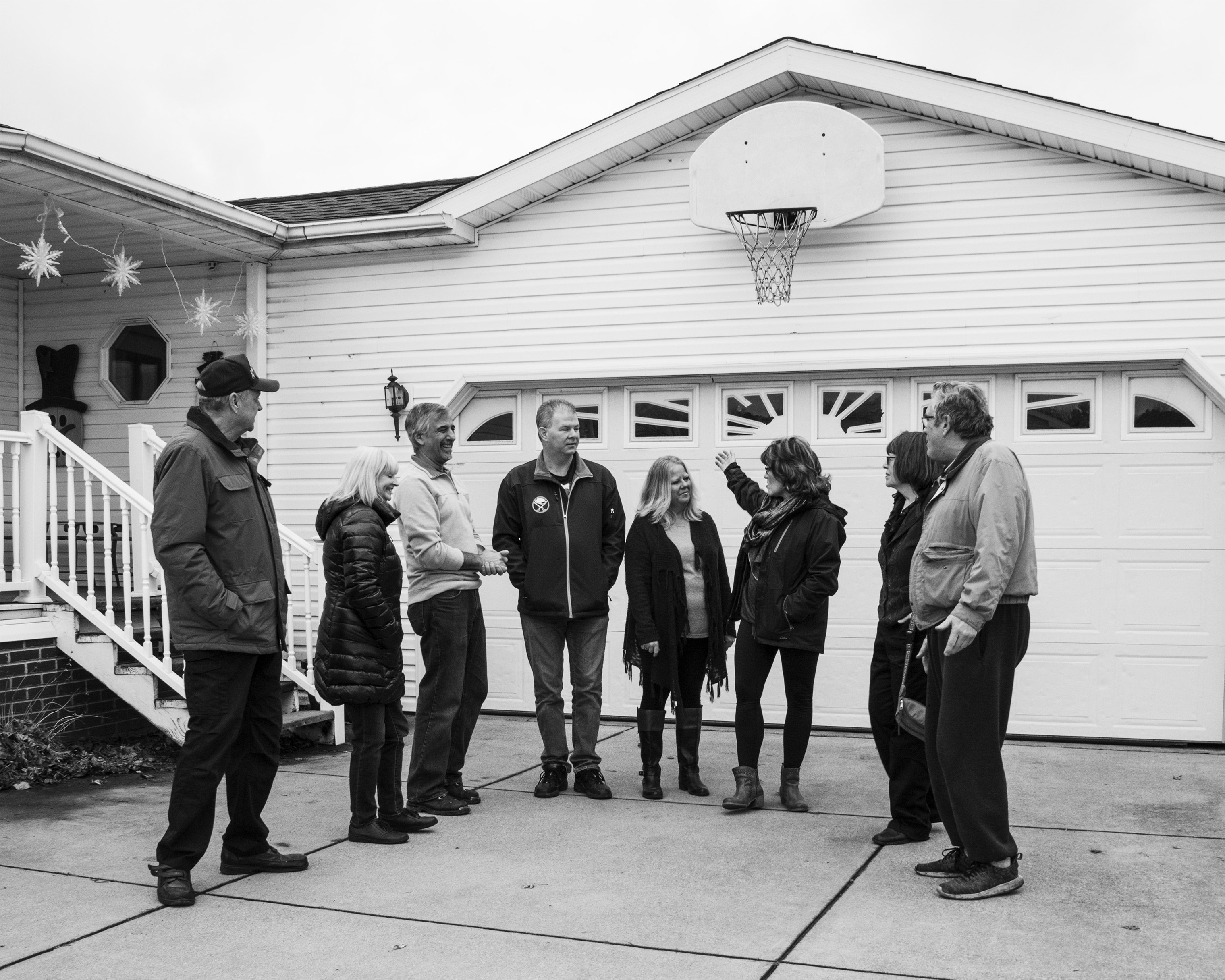 Maribeth Sheedy and her husband Shawn speak with other residents of the Akron Manufactured Home Community (Shane Lavalette for TIME)