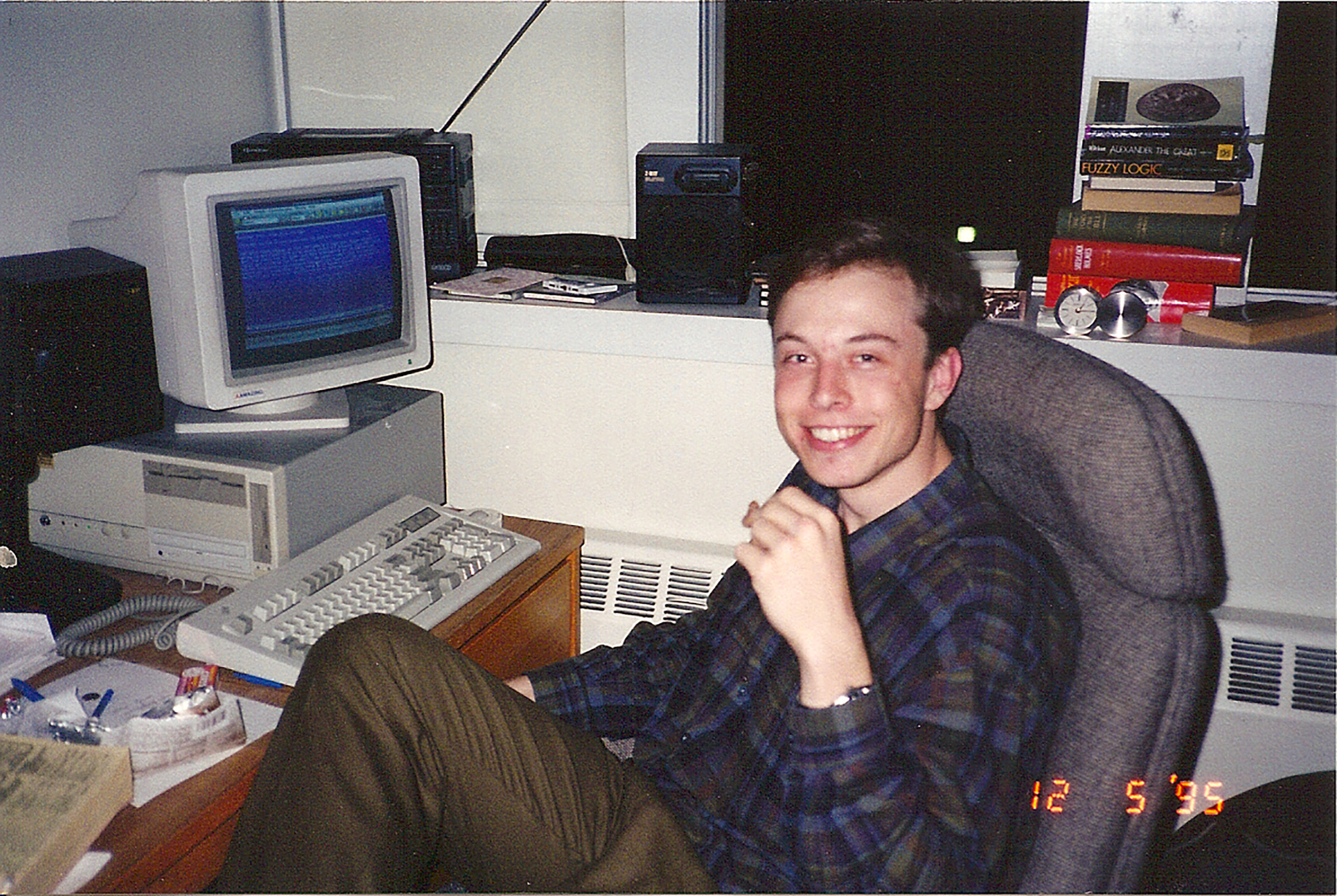 Musk, age 24, at his computer in 1995; that year, he co-founded his first company, Zip2, an online city guide that was a precursor to MapQuest and Yelp (Courtesy Maye Musk)