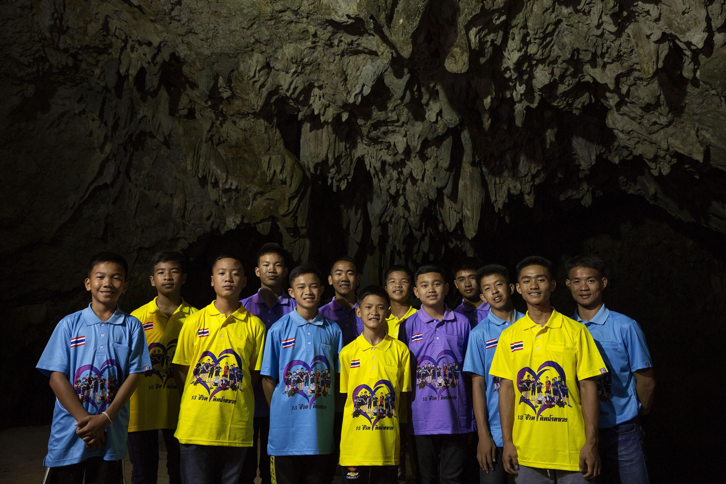 Nearly six months after the rescue, the team poses at the entrance to Tham Luang Cave