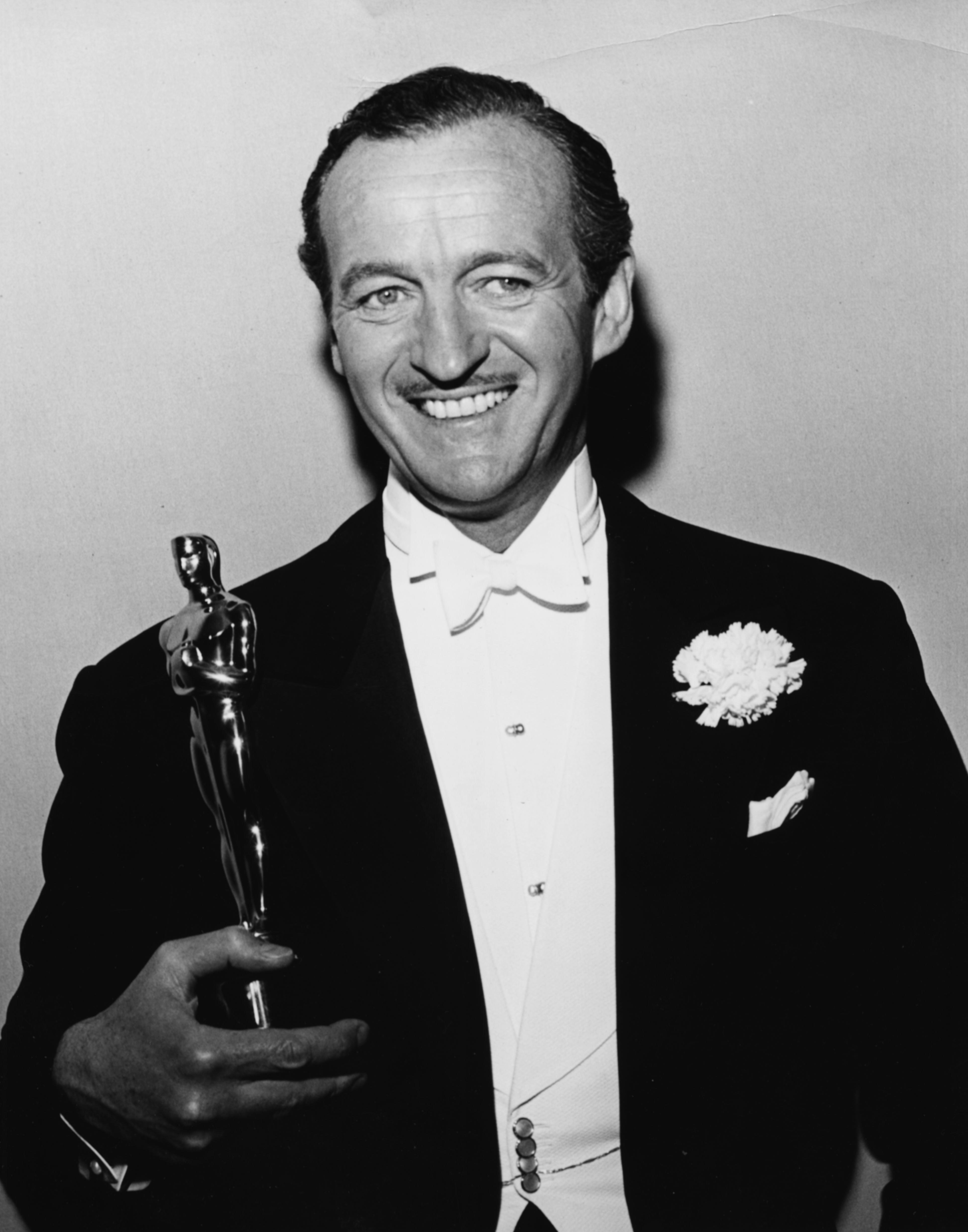 Actor David Niven holding his Best Actor Oscar for the film 'Separate Tables', at the 31st Academy Awards, Los Angeles, April 6th 1959. (Archive Photos—Getty Images)