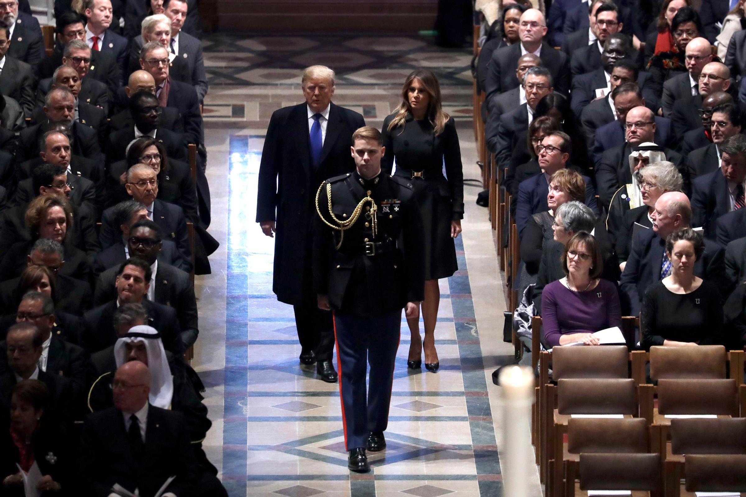 President Donald Trump and first lady Melania Trump arrive at the funeral of ormer President George H.W. Bush, at the National Cathedral
