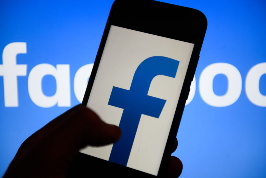 Facebook logo is seen on an android mobile phone