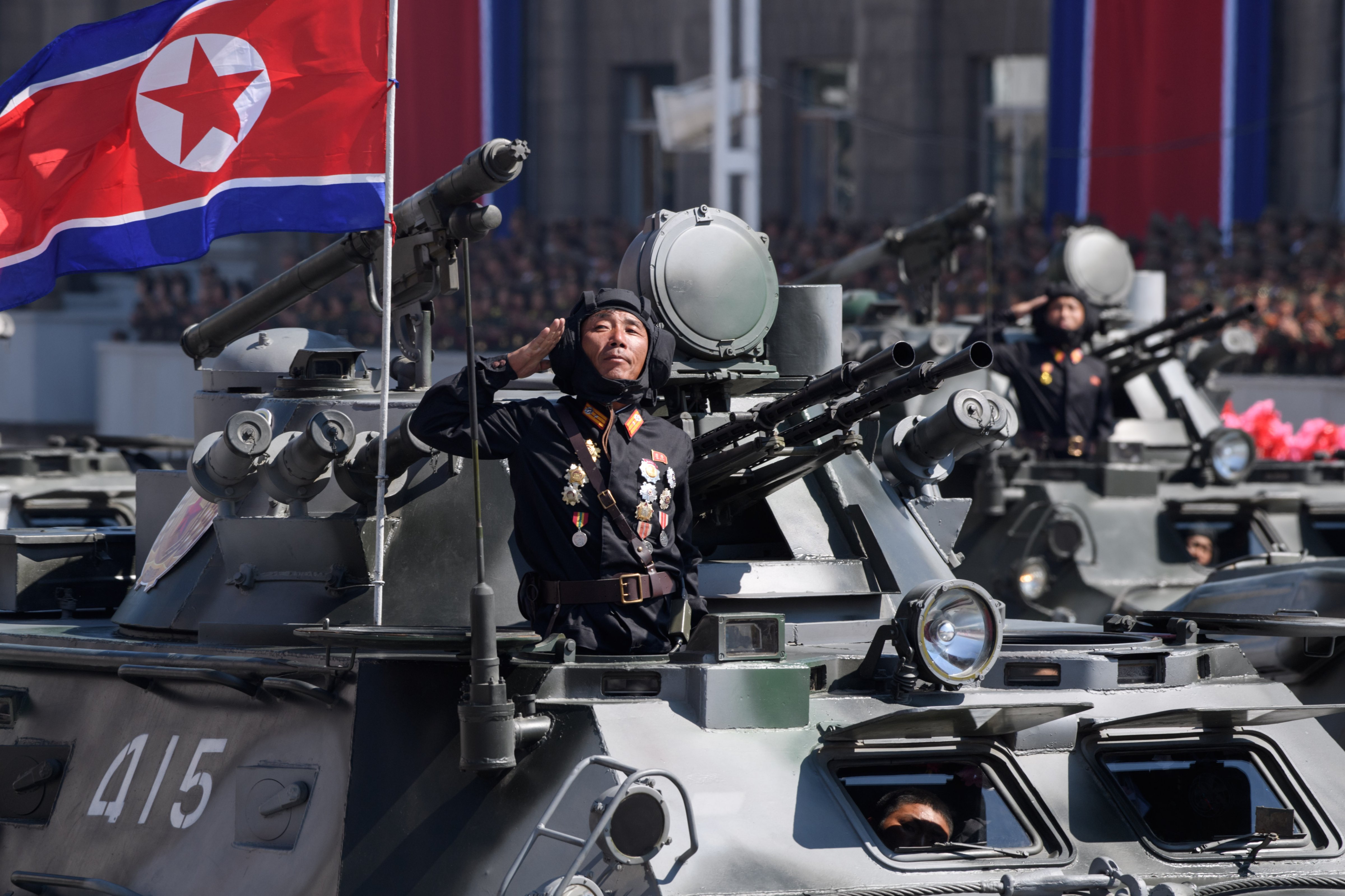 Korean People's Army (KPA) soldiers stand atop armored vehicles during a military parade in Pyongyang, North Korea on Sept. 9, 2018. (Ed Jones—AFP/Getty Images)