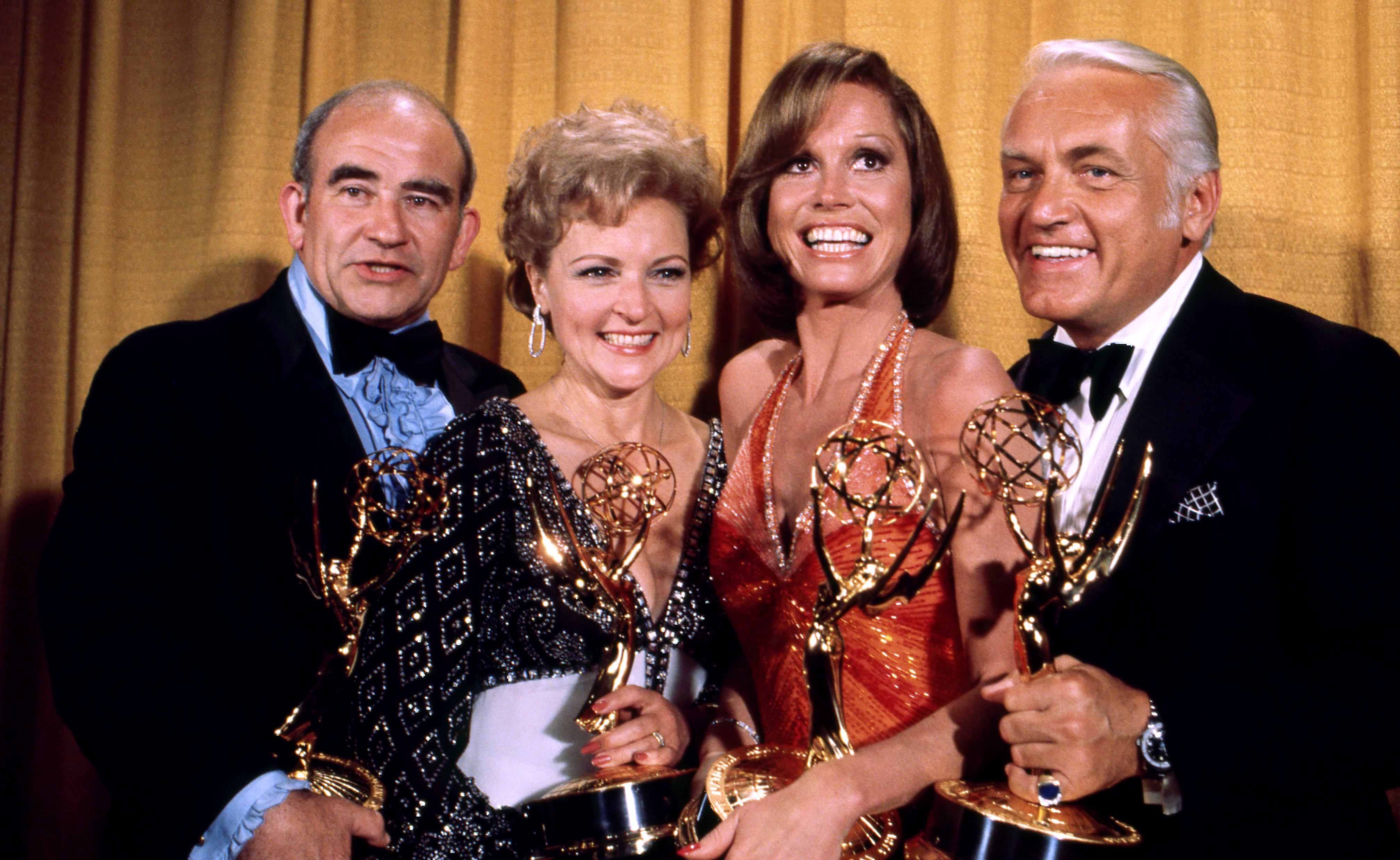 Edward Asner, Betty White, Mary Tyler Moore and Ted Knight holding their Emmy Awards in the press room at the 28th Annual Primetime Emmy Awards on May 17, 1976 at The Shubert Theatre in Los Angeles, California. (ABC Photo Archives—ABC via Getty Images)