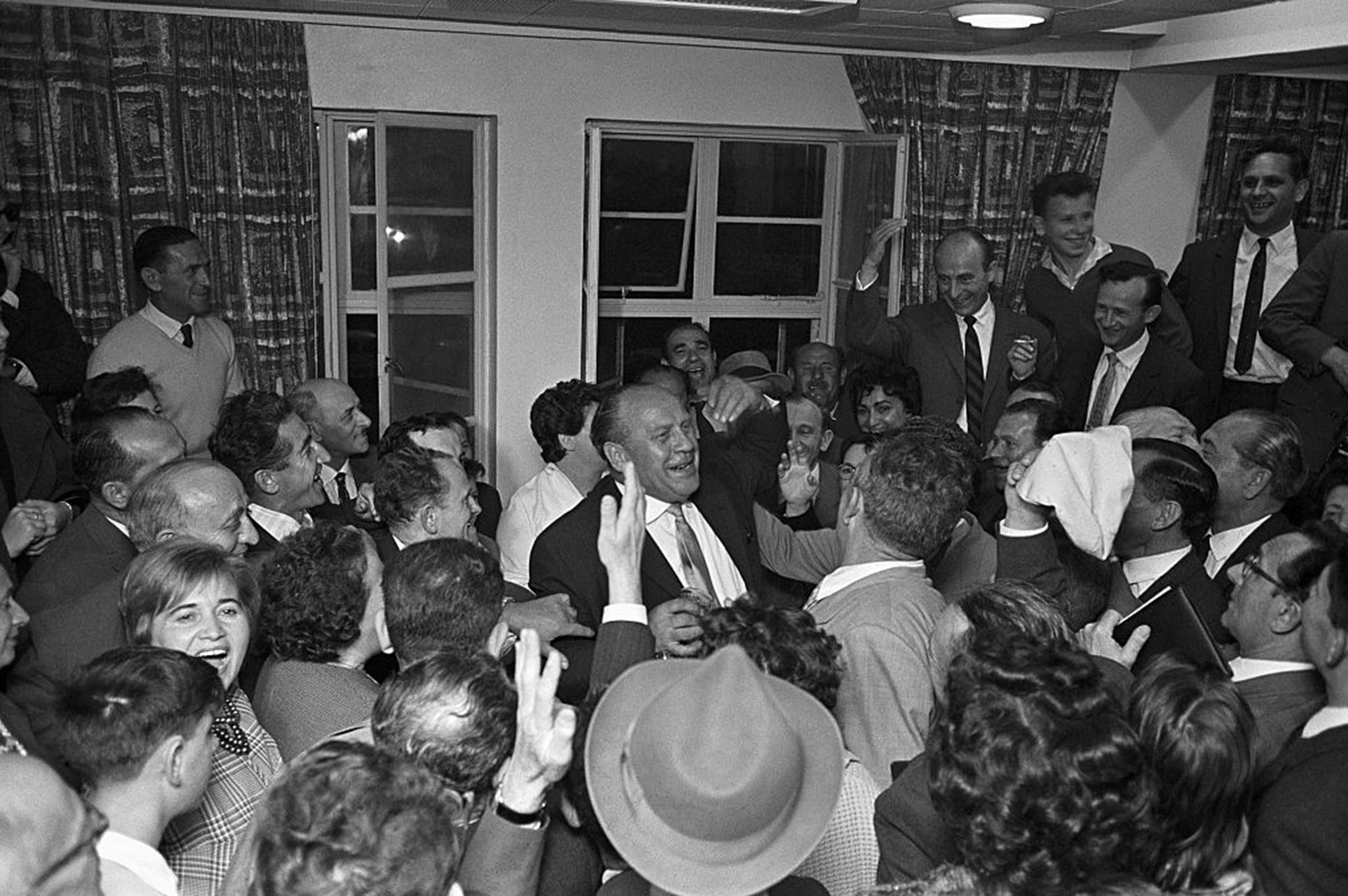 Oskar Schindler (center) receives a hero's welcome from some of the Holocaust survivors he saved during a May 1962 visit to Tel Aviv, Israel. (David Rubinger/CORBIS/Corbis—Getty Images)