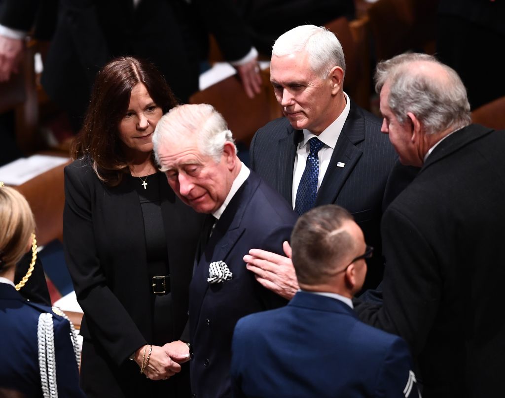 Britain's Prince Charles is greeted by Karen Pence and her husband, U.S. Vice President Mike Pence, as they arrive for the funeral service for former US President George H. W. Bush at the National Cathedral in Washington, DC on December 5, 2018. (Brendan Smialowski — AFP/Getty Images)