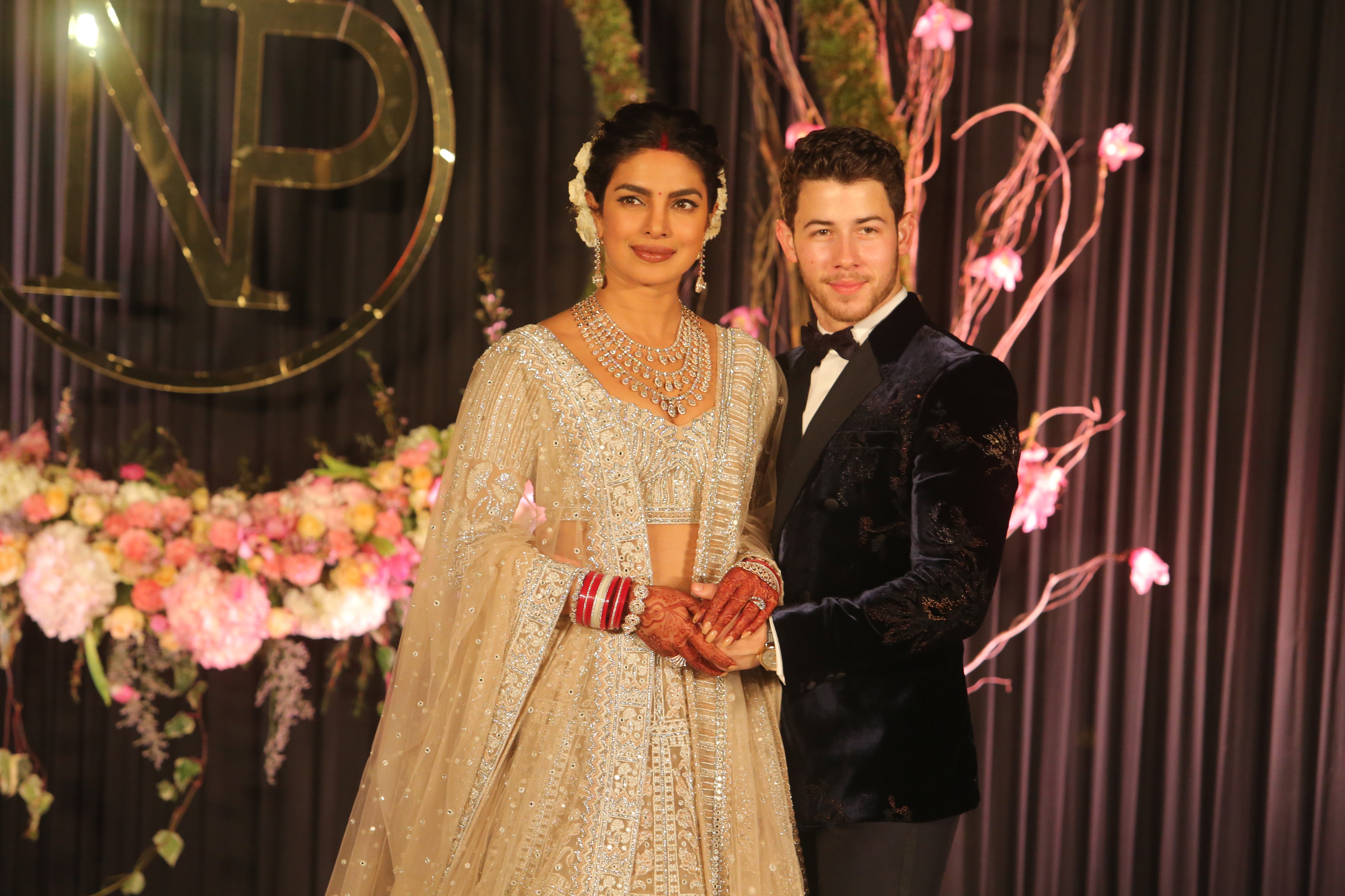 Newly-wed Bollywood actor Priyanka Chopra and American singer Nick Jonas pose for photos during their wedding reception, at Taj Palace on December 4, 2018 in New Delhi, India. (Hindustan Times&mdash;Hindustan Times via Getty Images)