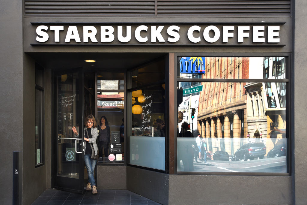 A customer leaves a Starbucks Coffee shop