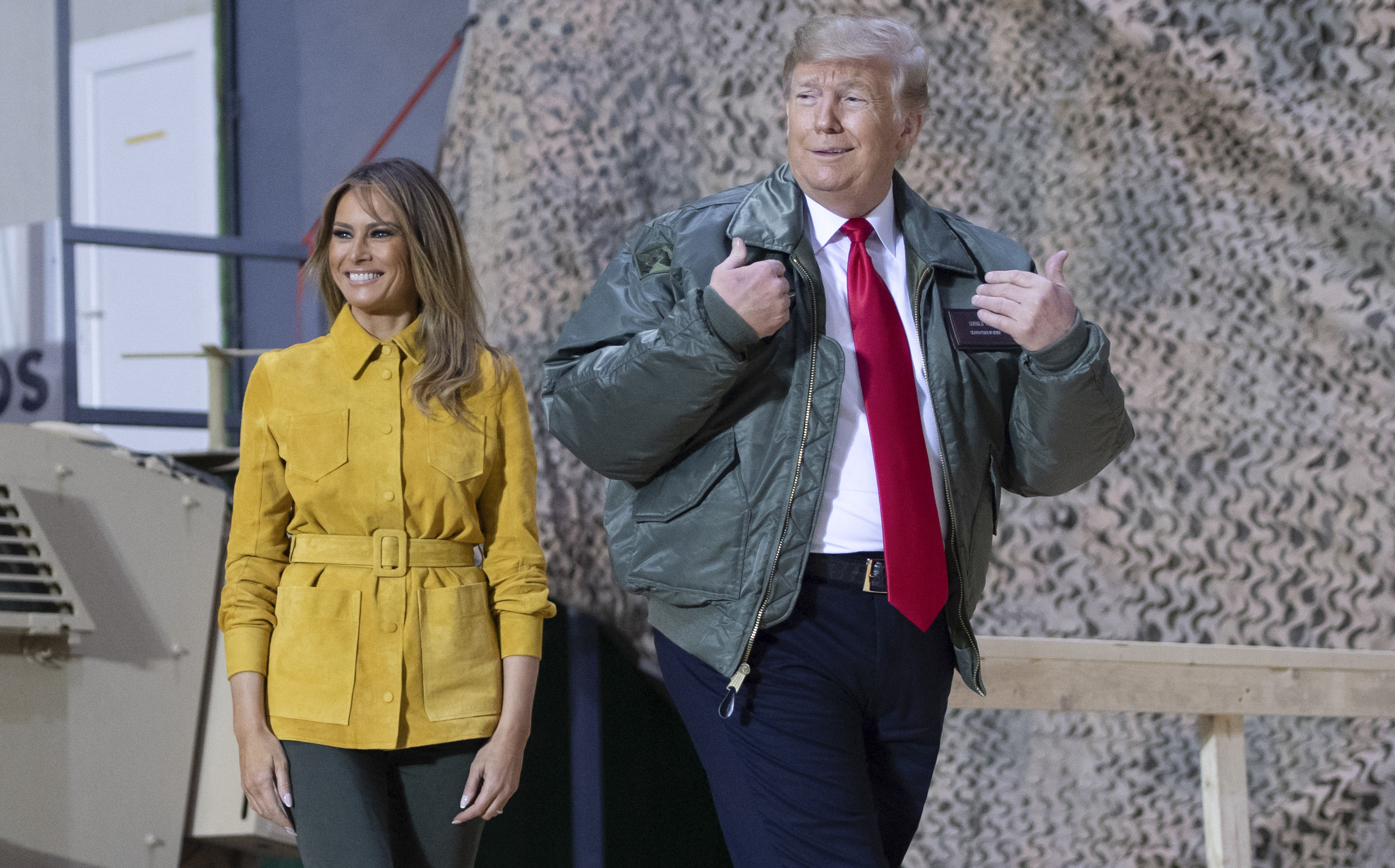 President Donald Trump and First Lady Melania Trump arrive to speak to members of the US military during an unannounced trip to Al Asad Air Base in Iraq on December 26, 2018. (SAUL LOEB—AFP/Getty Images)