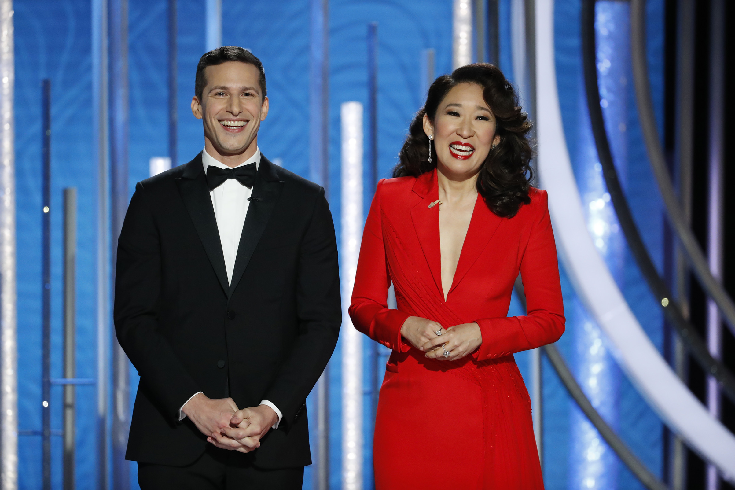 Hosts Andy Samberg and Sandra Oh speak onstage during the 76th Annual Golden Globe Awards. (NBCUniversal/Getty Images)